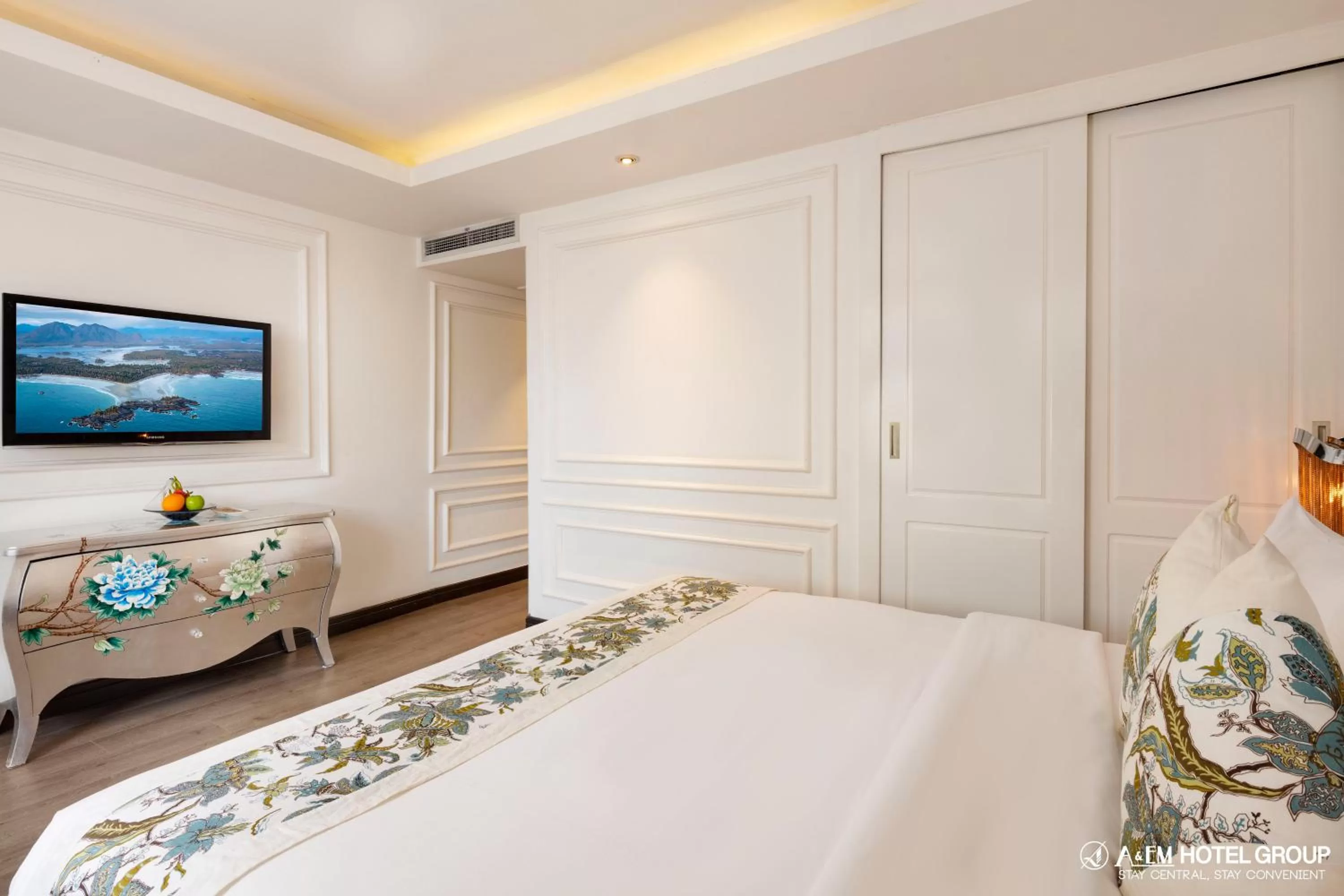 Bed in A&EM Saigon Hotel