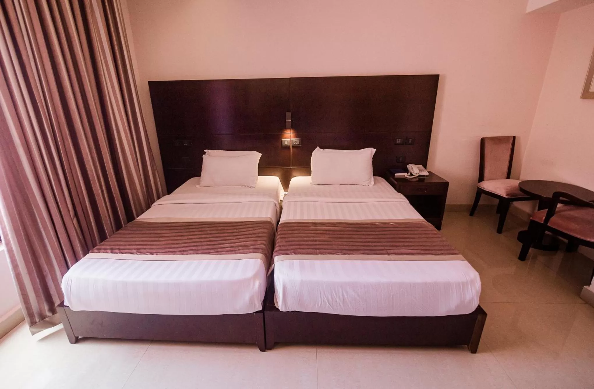 Bed in Noble House Hotel