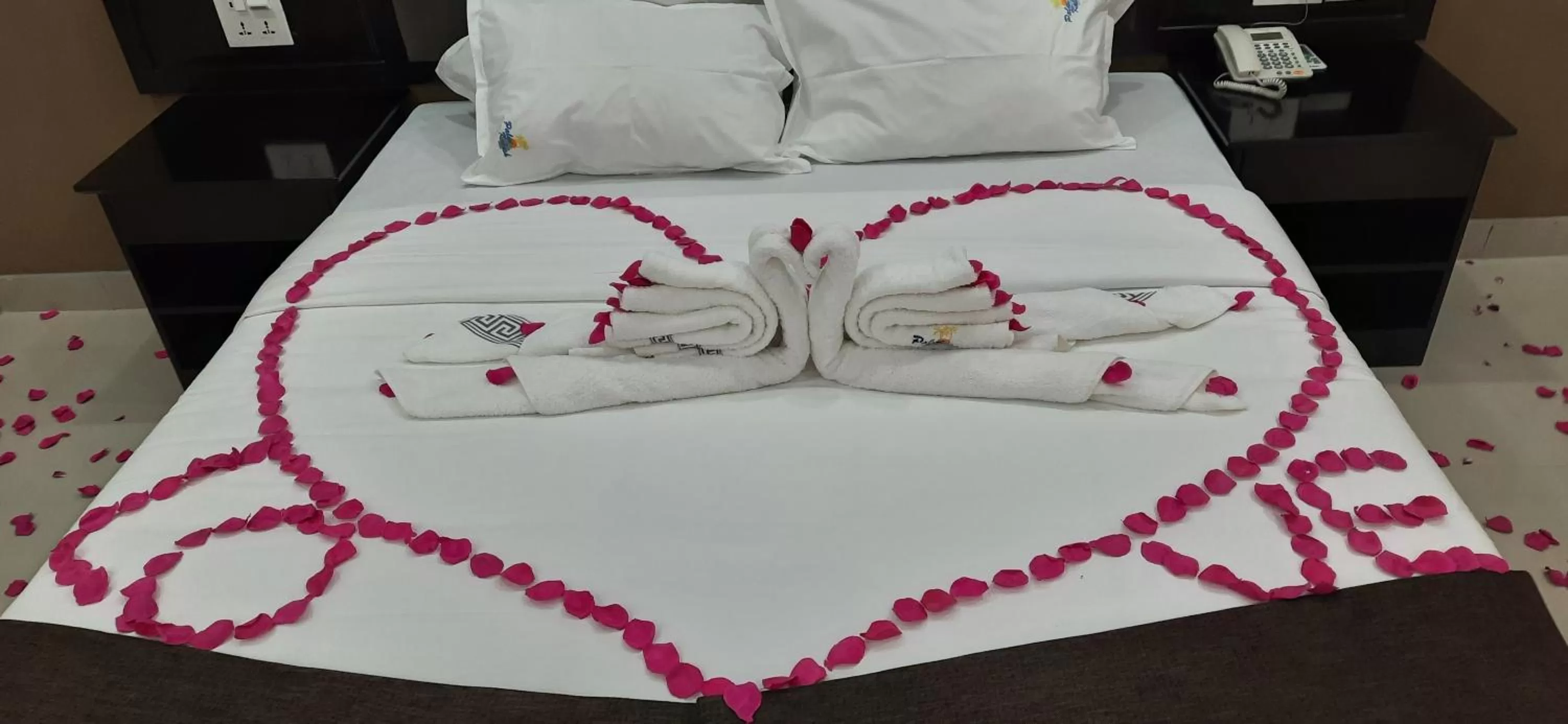 Bed in Palm Kalash Hotel