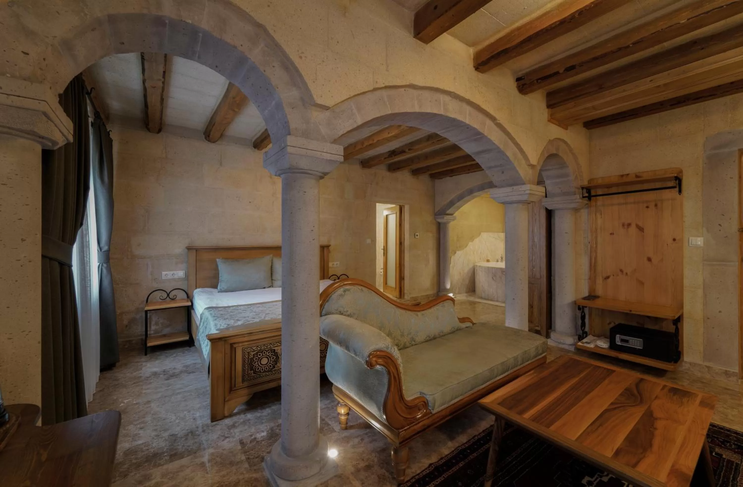 Seating area, Bed in Cratus Stone Palace