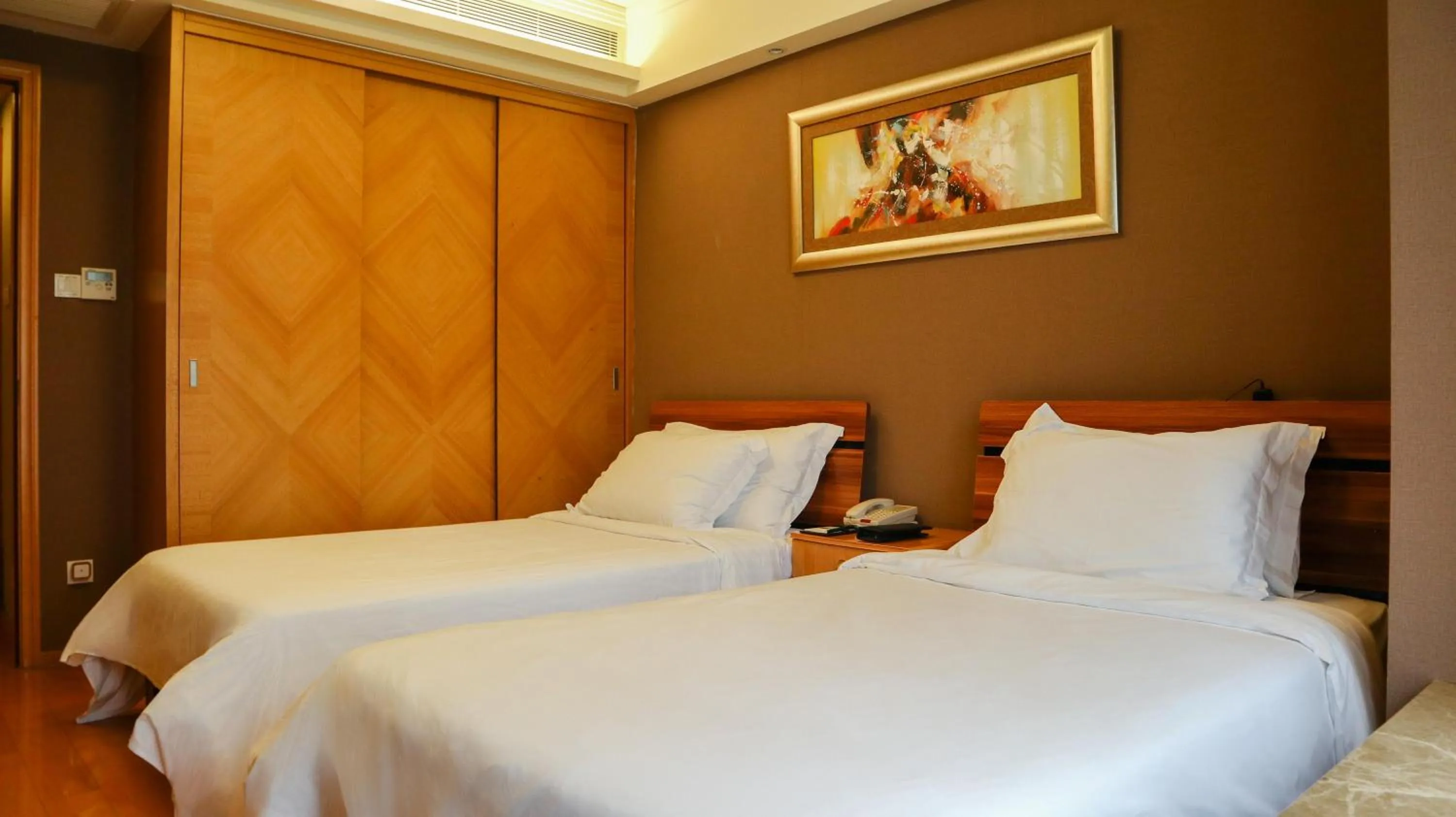 Bed in 广州丹顿行政公寓-Dan Executive Apartment Guangzhou Zhujiang New Town
