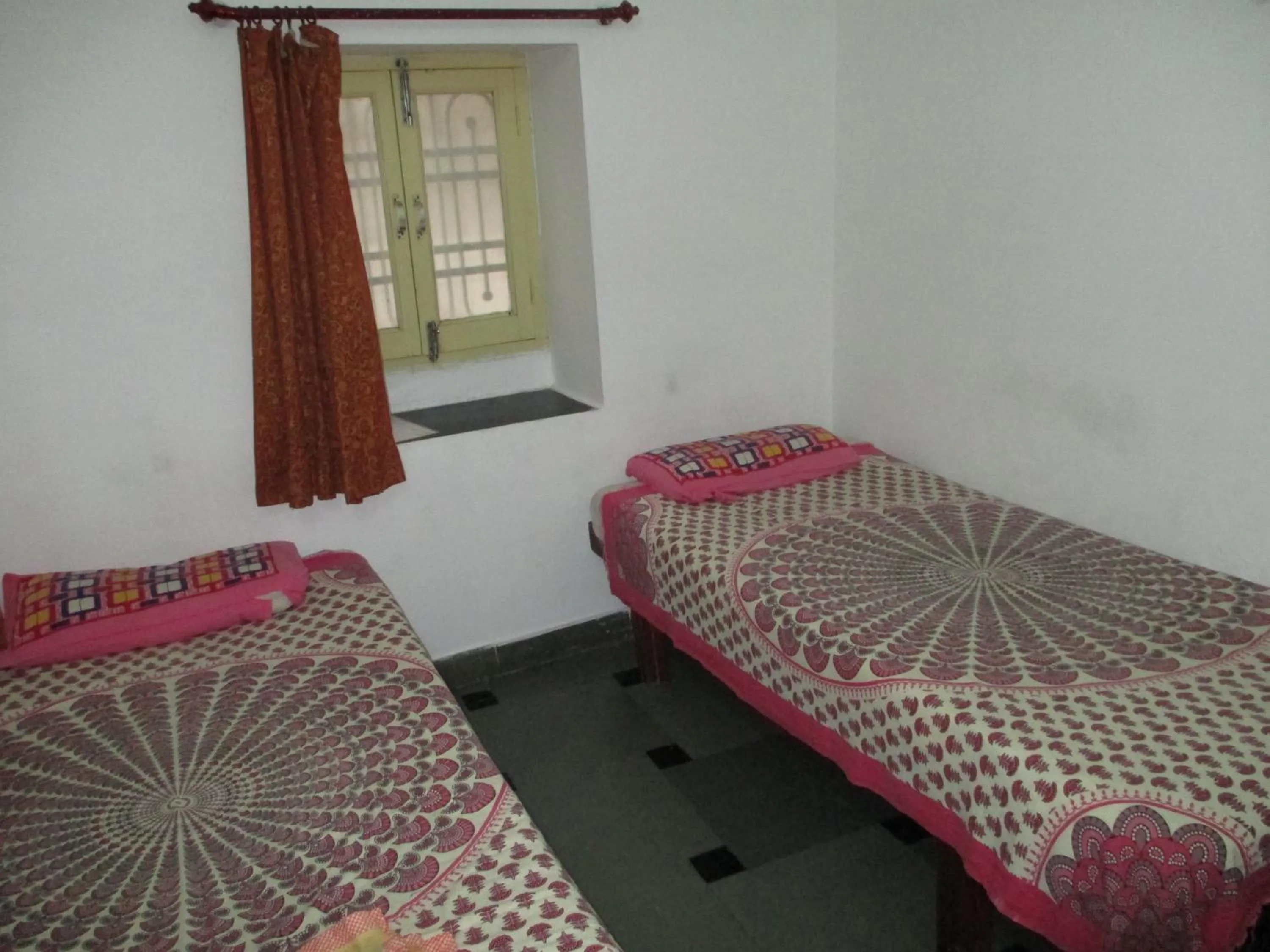 Bed in Udai Haveli Guest House