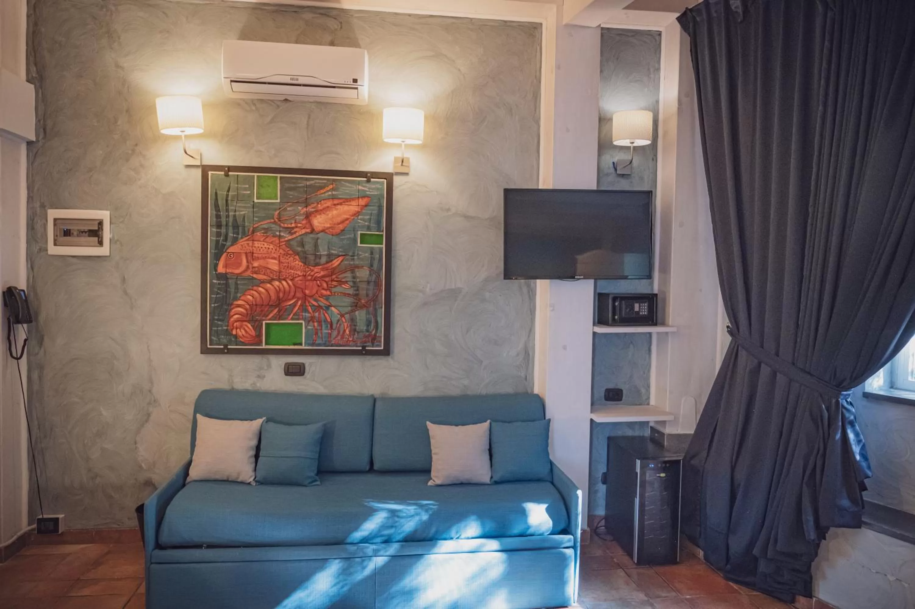 Bed, Seating Area in La Dimora del Faro