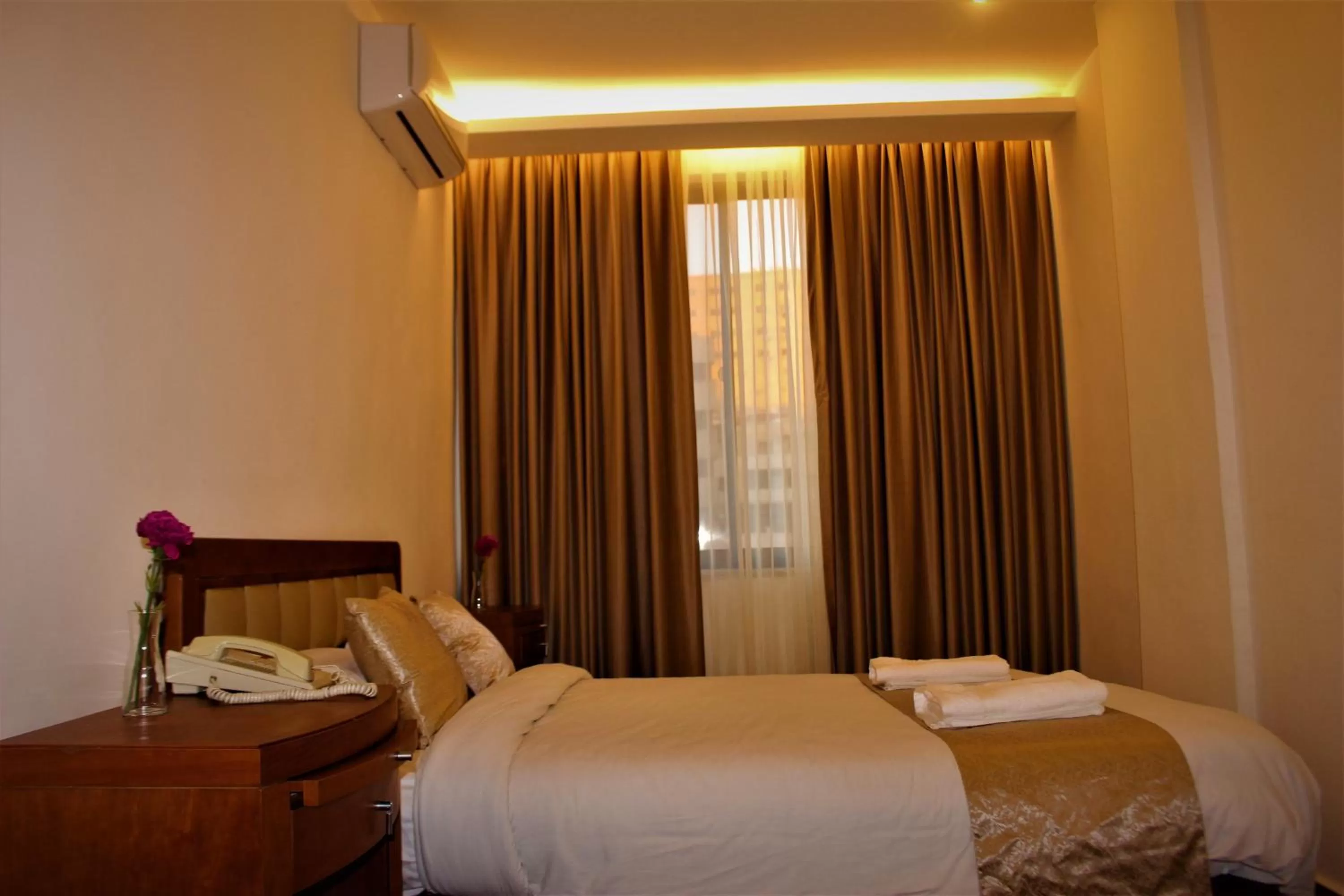 Bed in New MerryLand Hotel