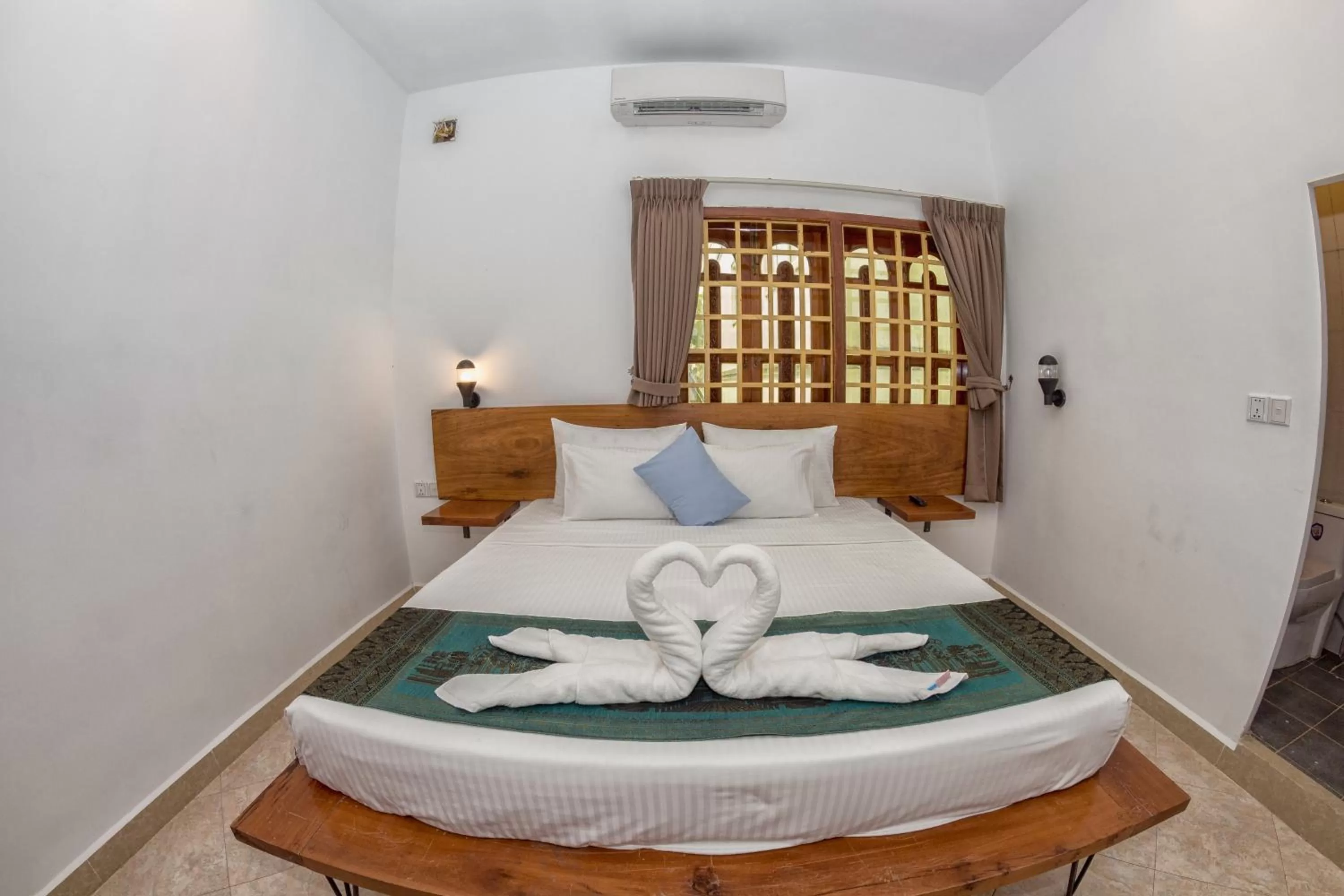 Bed in Poolside Villa