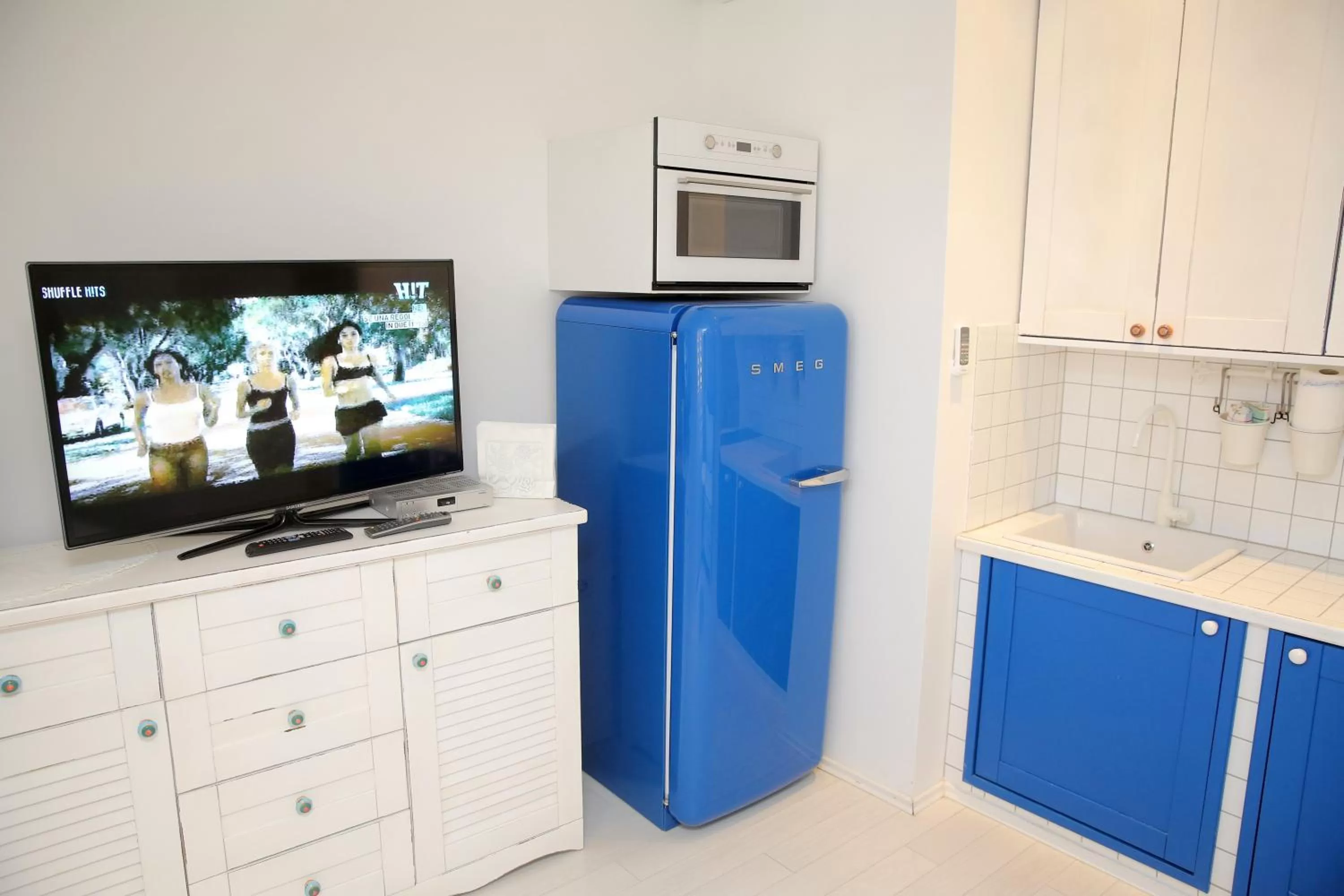 TV and multimedia in Central Apartments Integrated Hotel