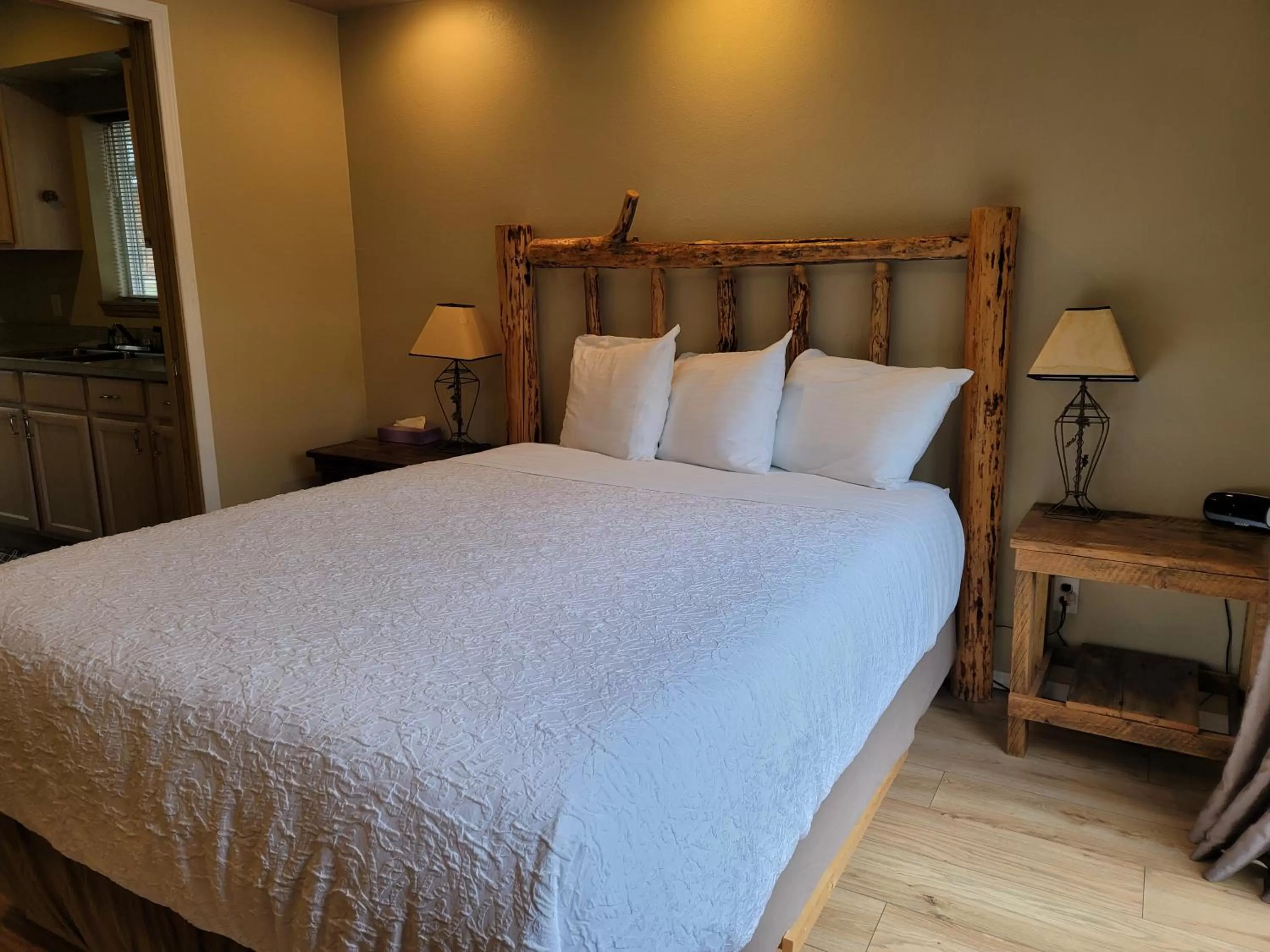 Bed in Riverfront Motel & Cabins