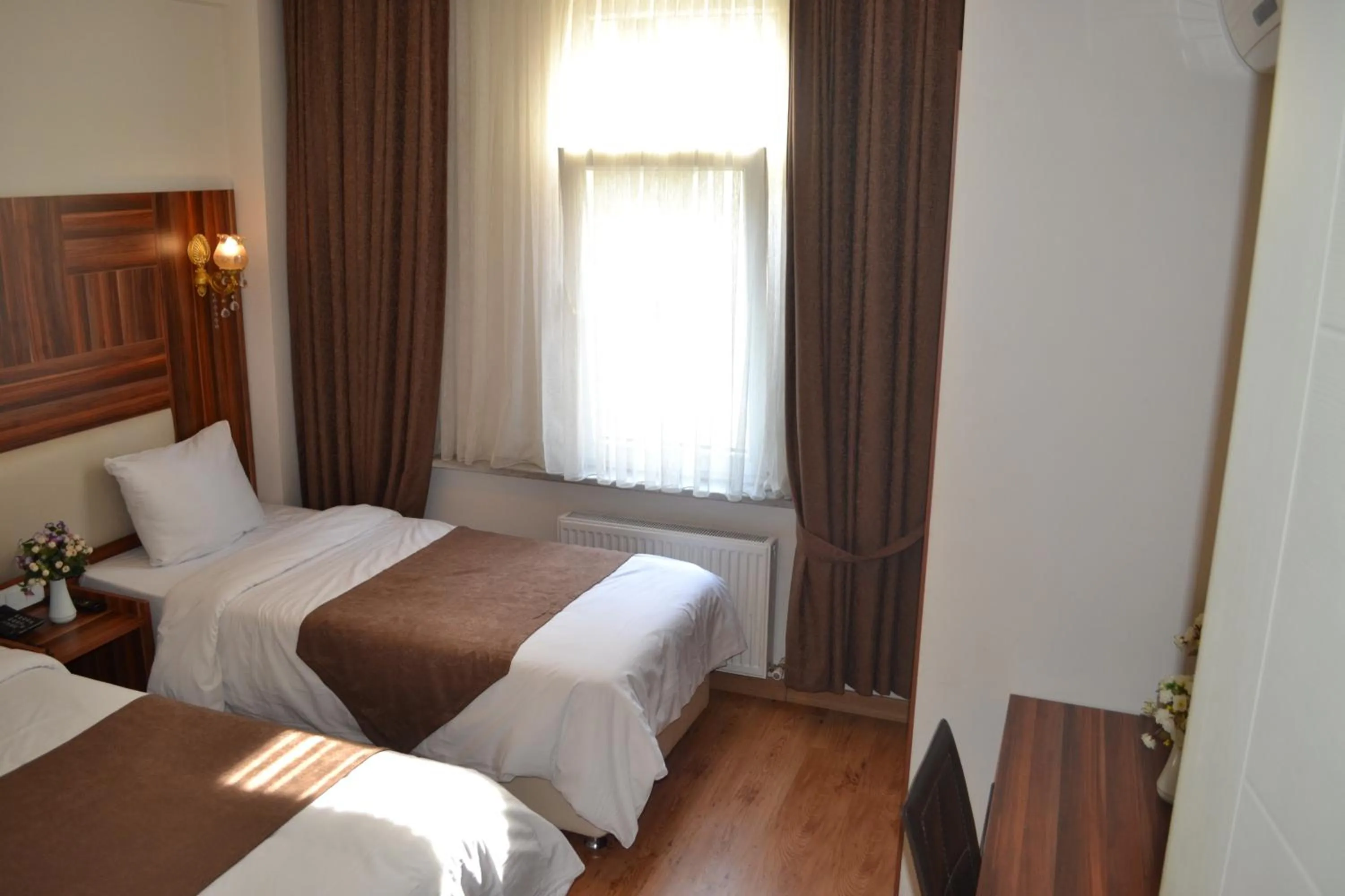 Seating area, Bed in New Fatih Hotel