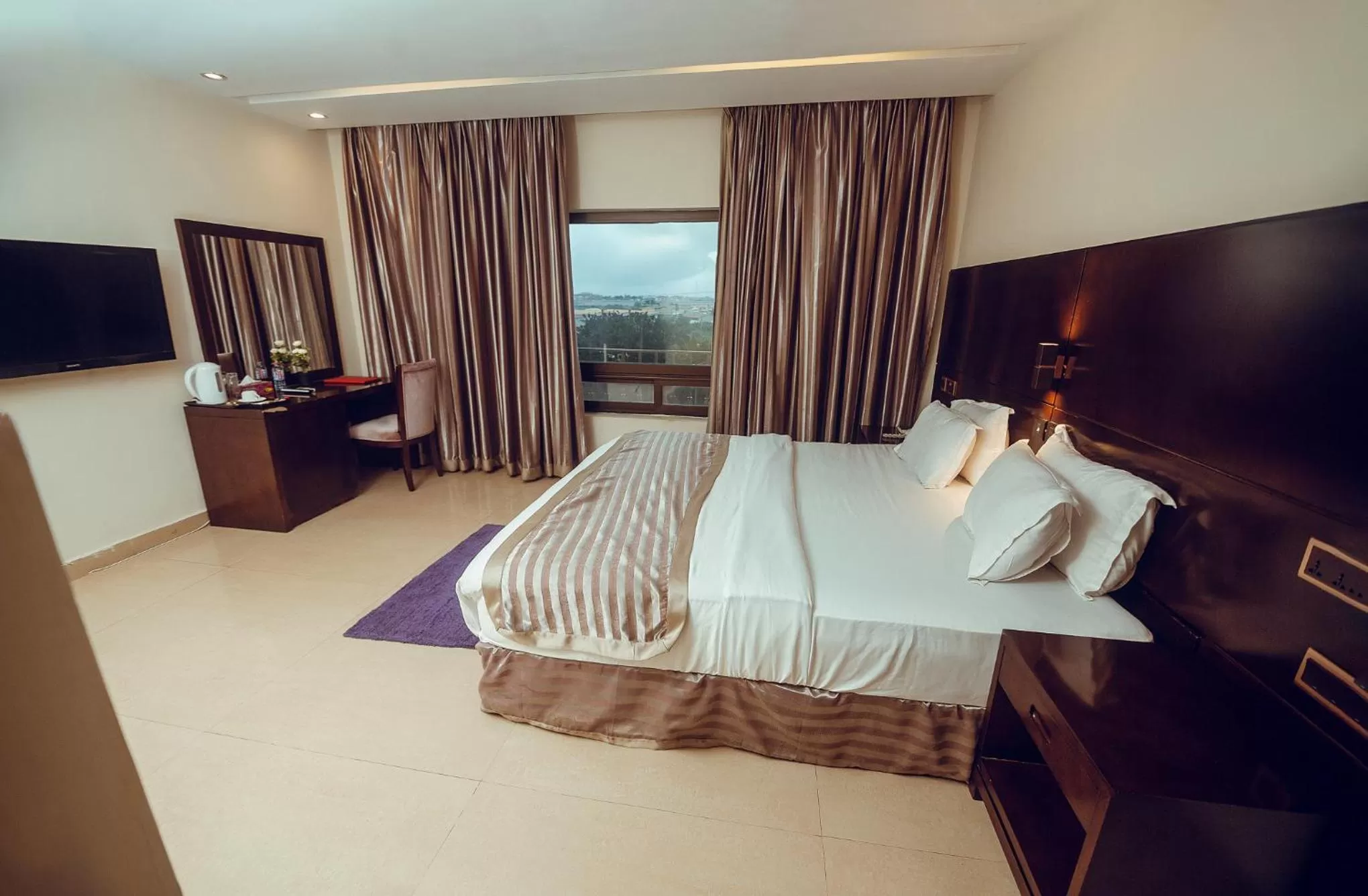 Photo of the whole room, TV/Entertainment Center in Noble House Hotel