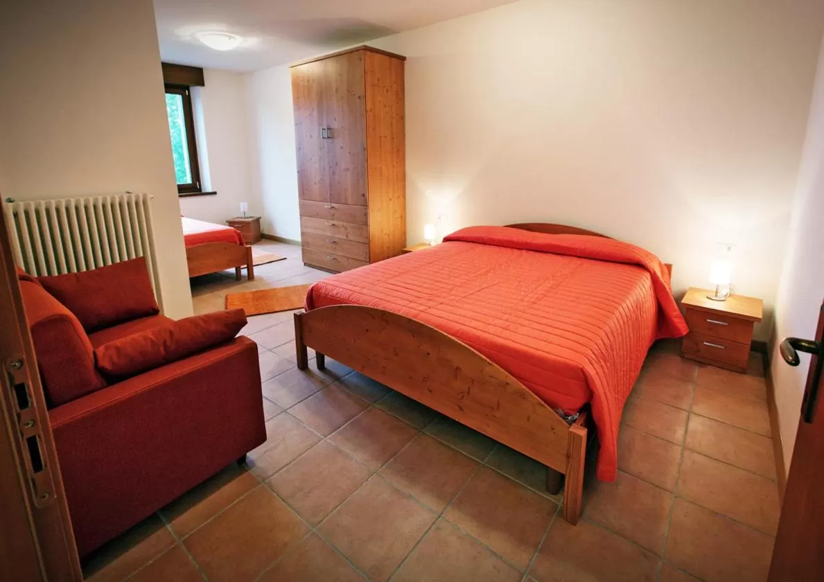 Photo of the whole room, Bed in Albergo Diffuso Tolmezzo