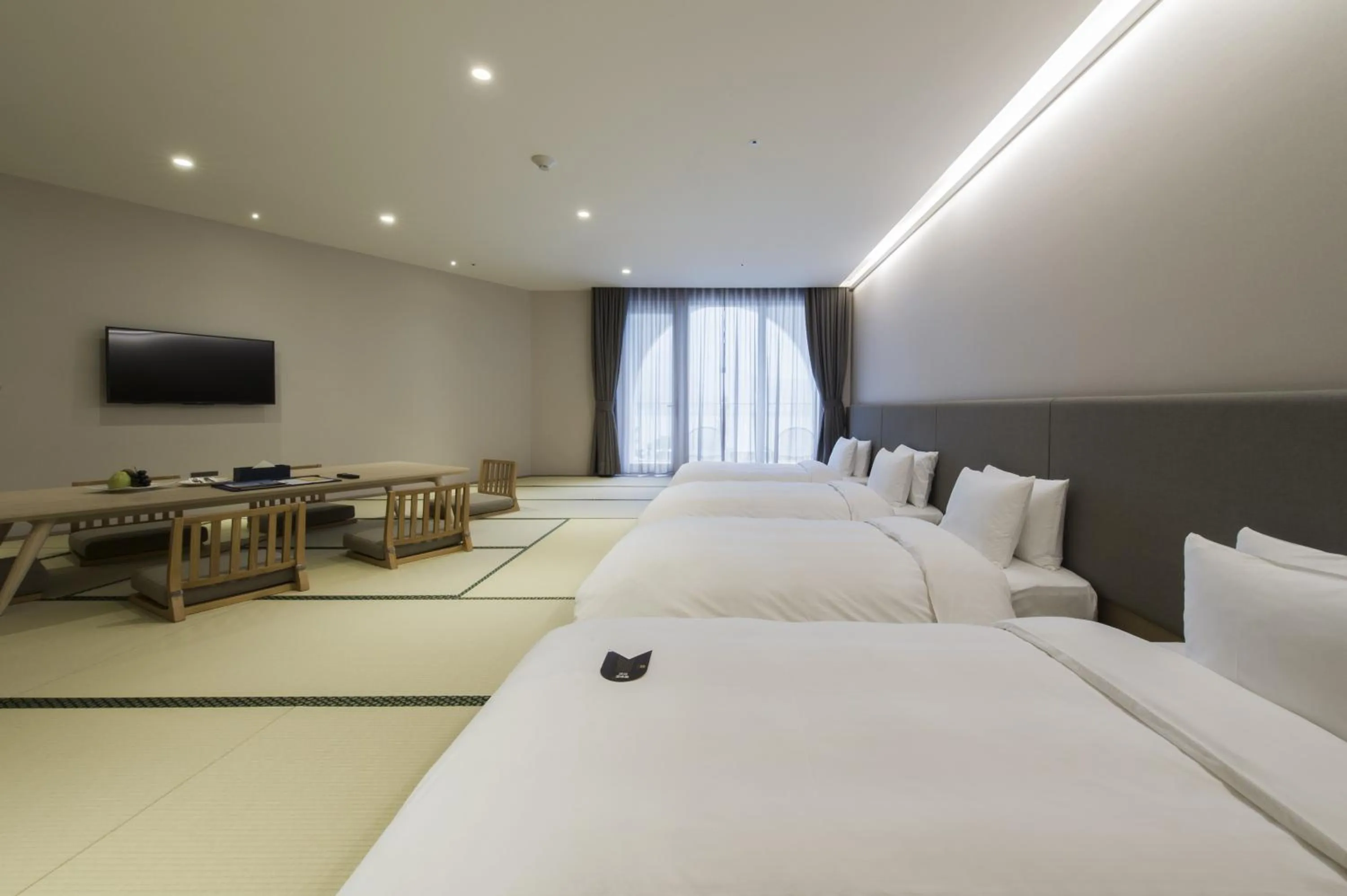 Photo of the whole room, Bed in Golden Tulip FAB Hotel New Taipei