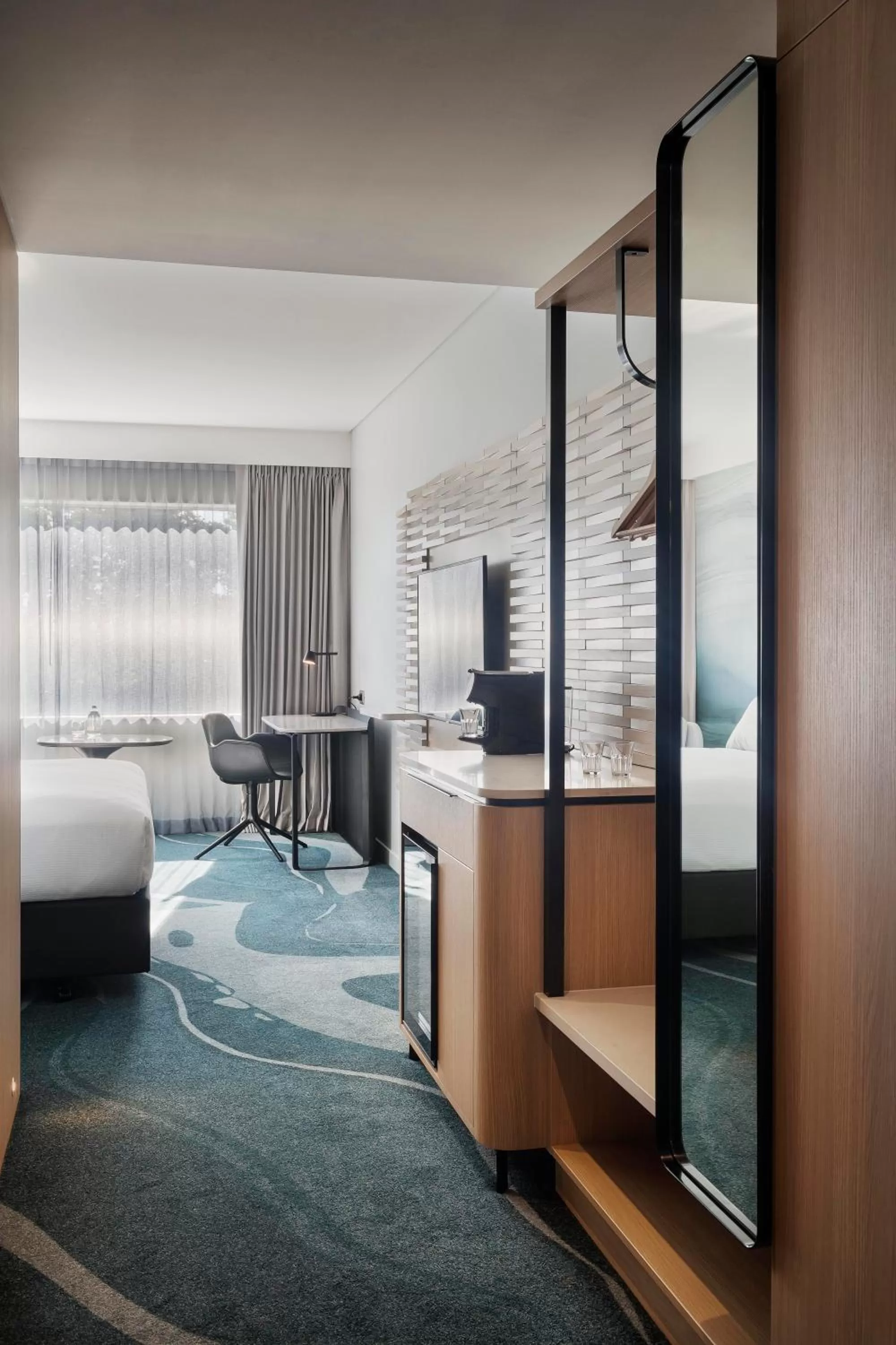 Seating area, Bed in Novotel Tainui Hamilton