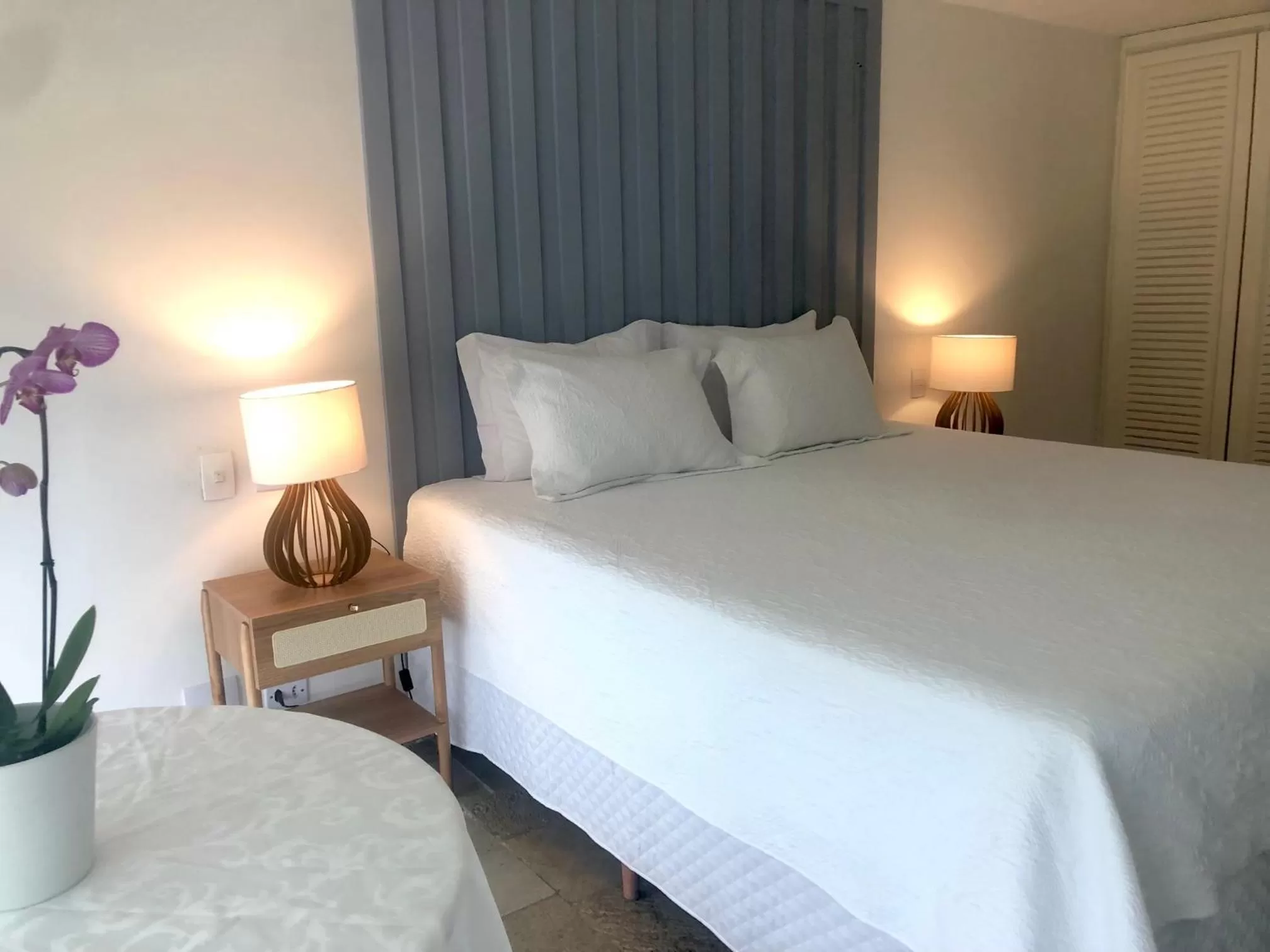 Bed in Guest House Guarujá