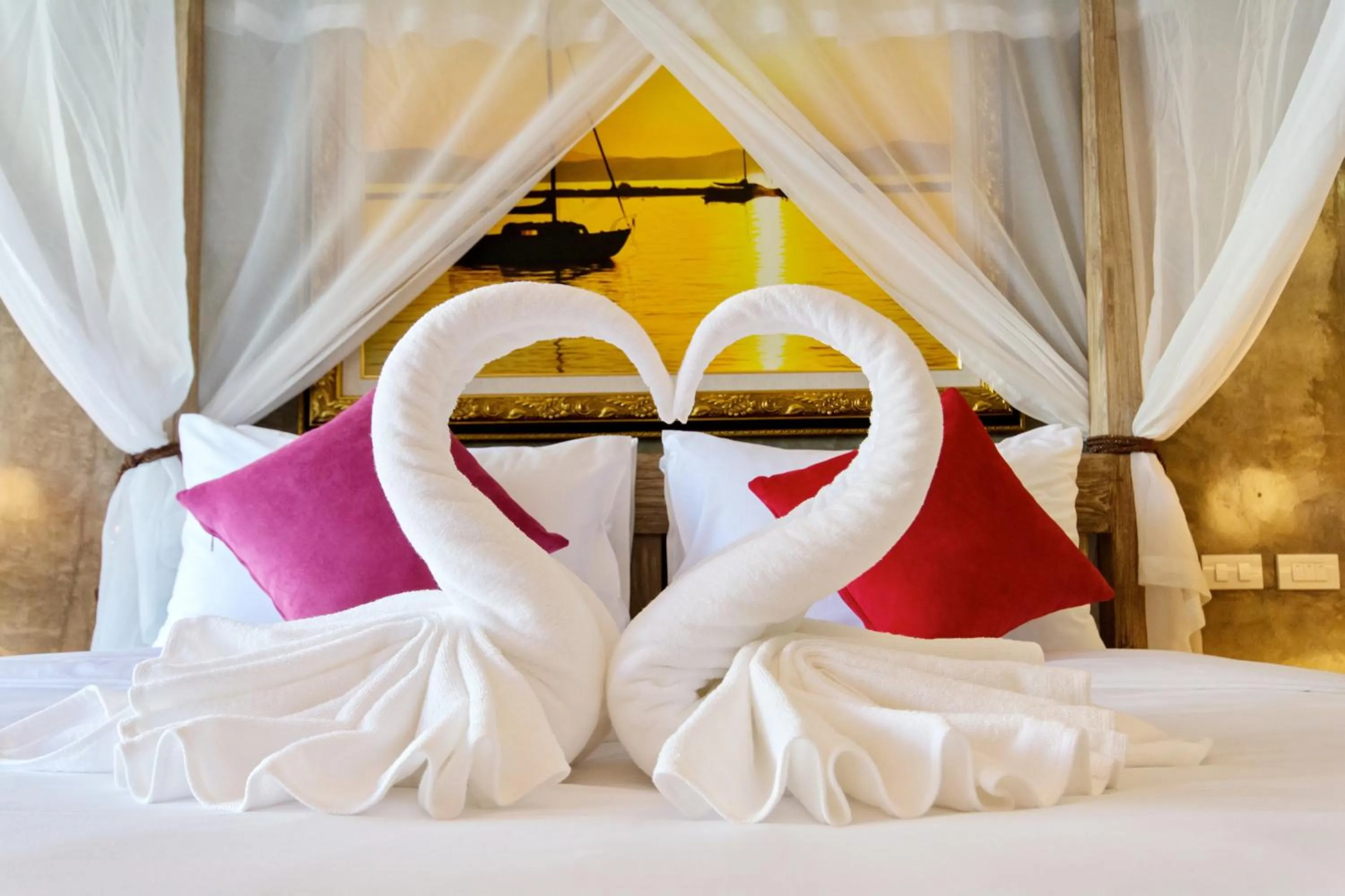 Bed in The Chaya Resort and Spa