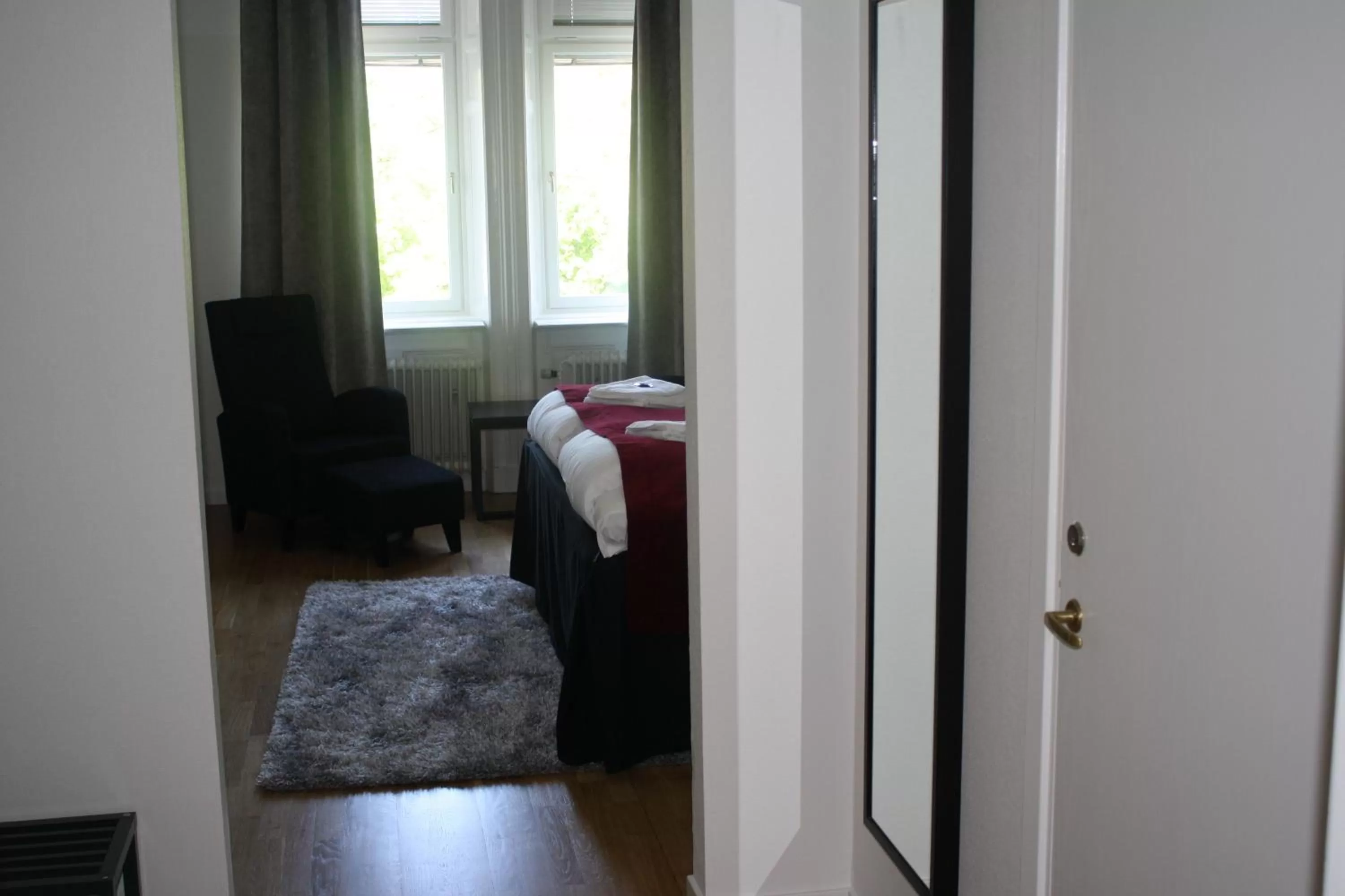 Photo of the whole room, Bed in Stadshotellet Kristinehamn