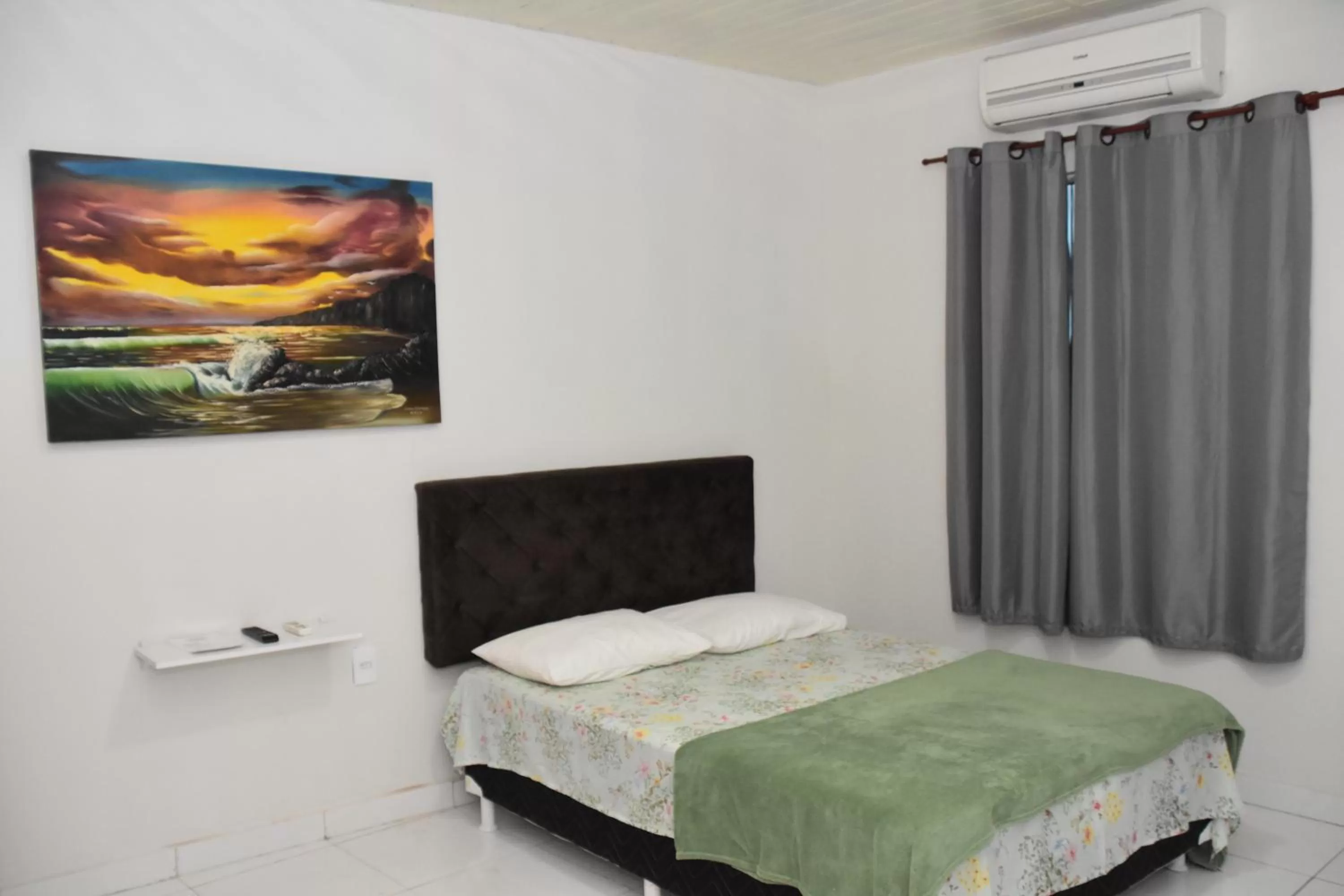 Bed in Pousada e Posto Amigão