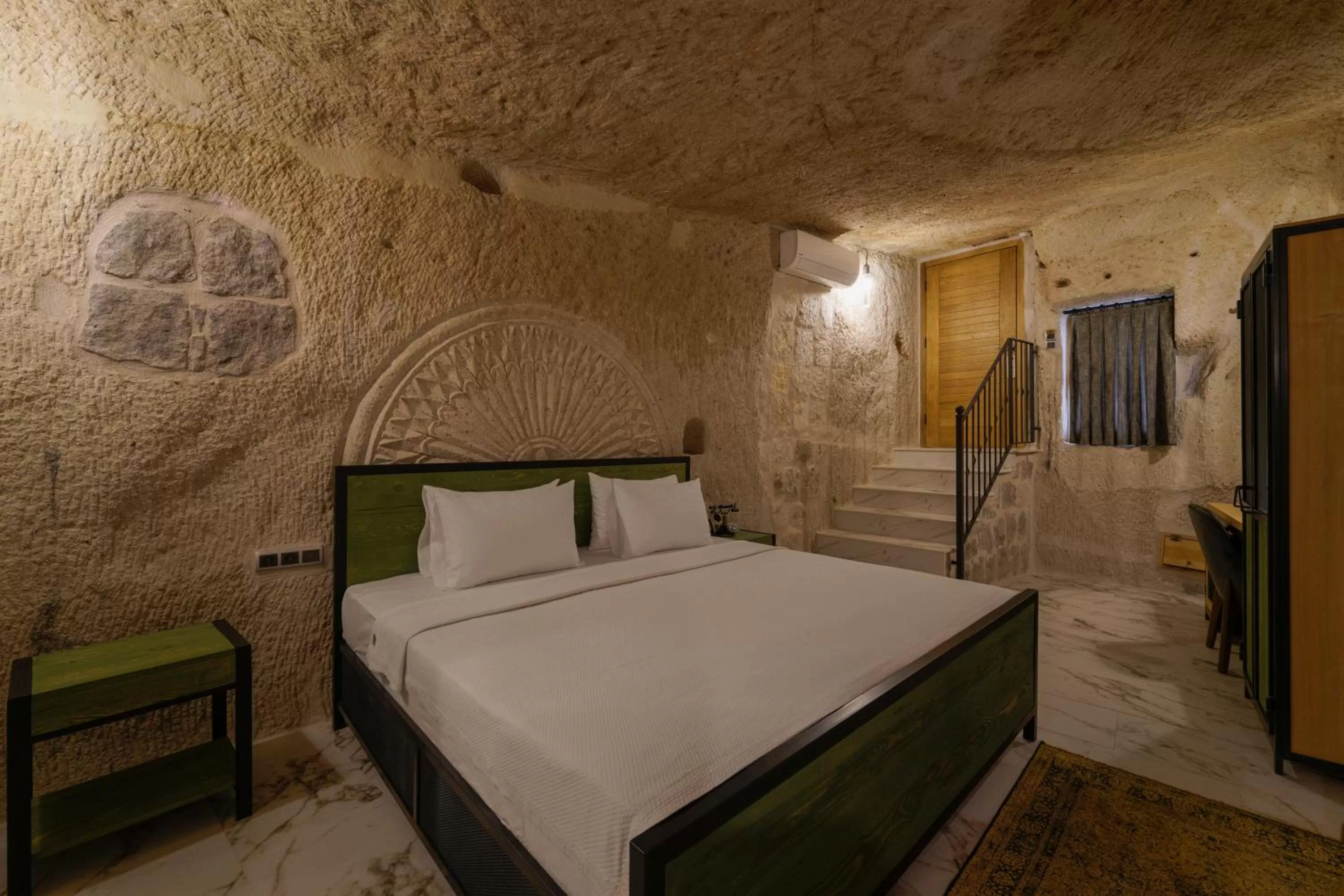 Bed in The Niche Cave Hotel