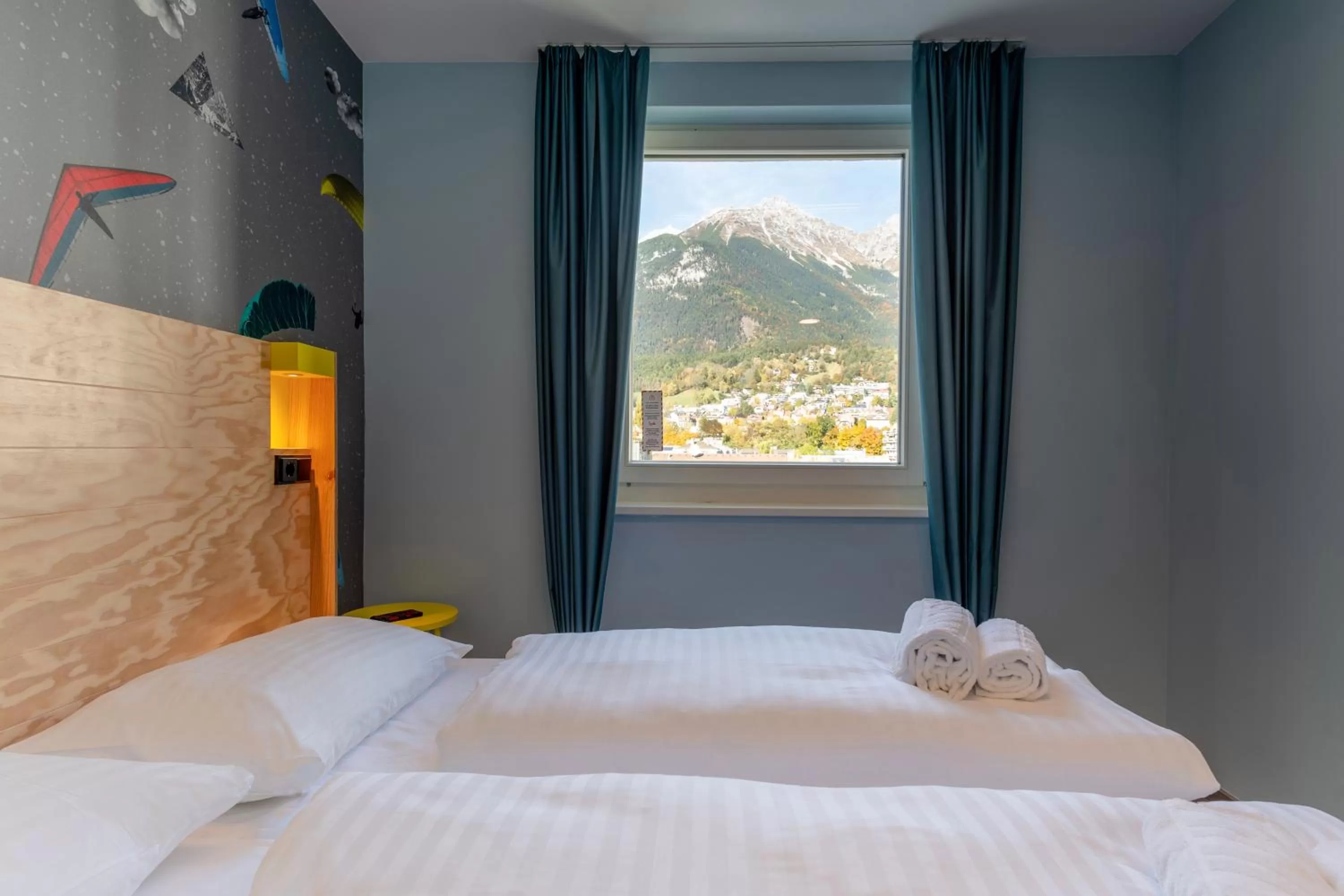 Photo of the whole room, Bed in MEININGER Hotel Innsbruck Zentrum