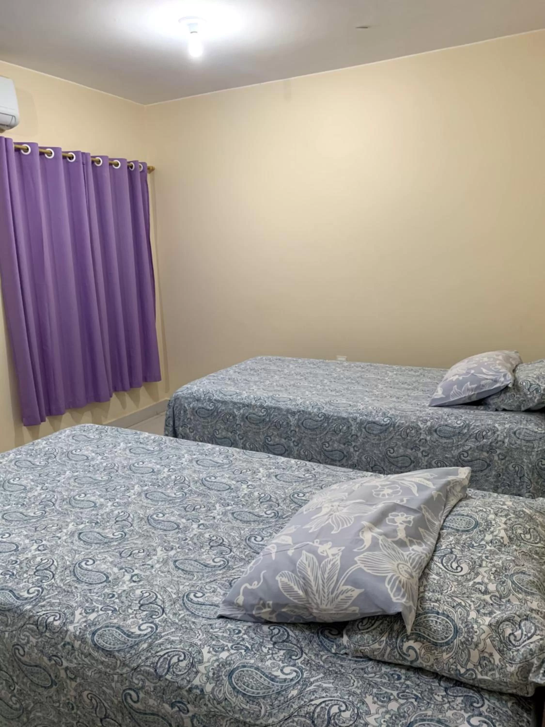 Bed in Pousada Jardim Brasília