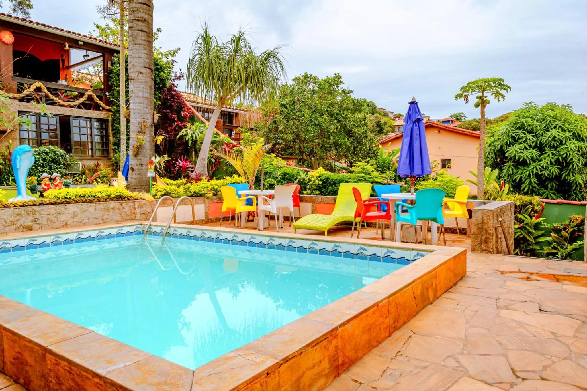 Swimming pool in Suítes Casa do Barão
