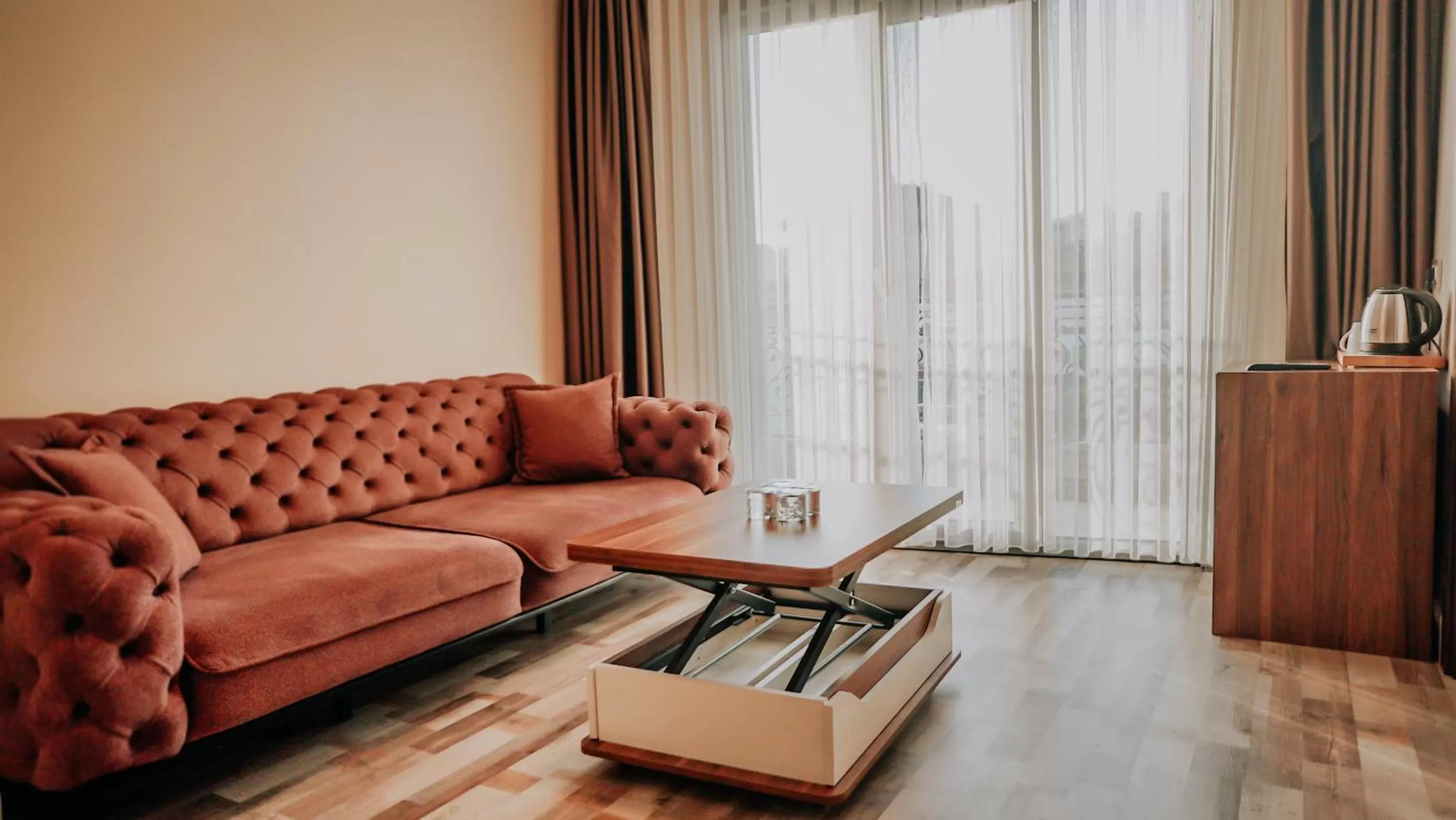 Living room in The Grand Mira Business Hotel