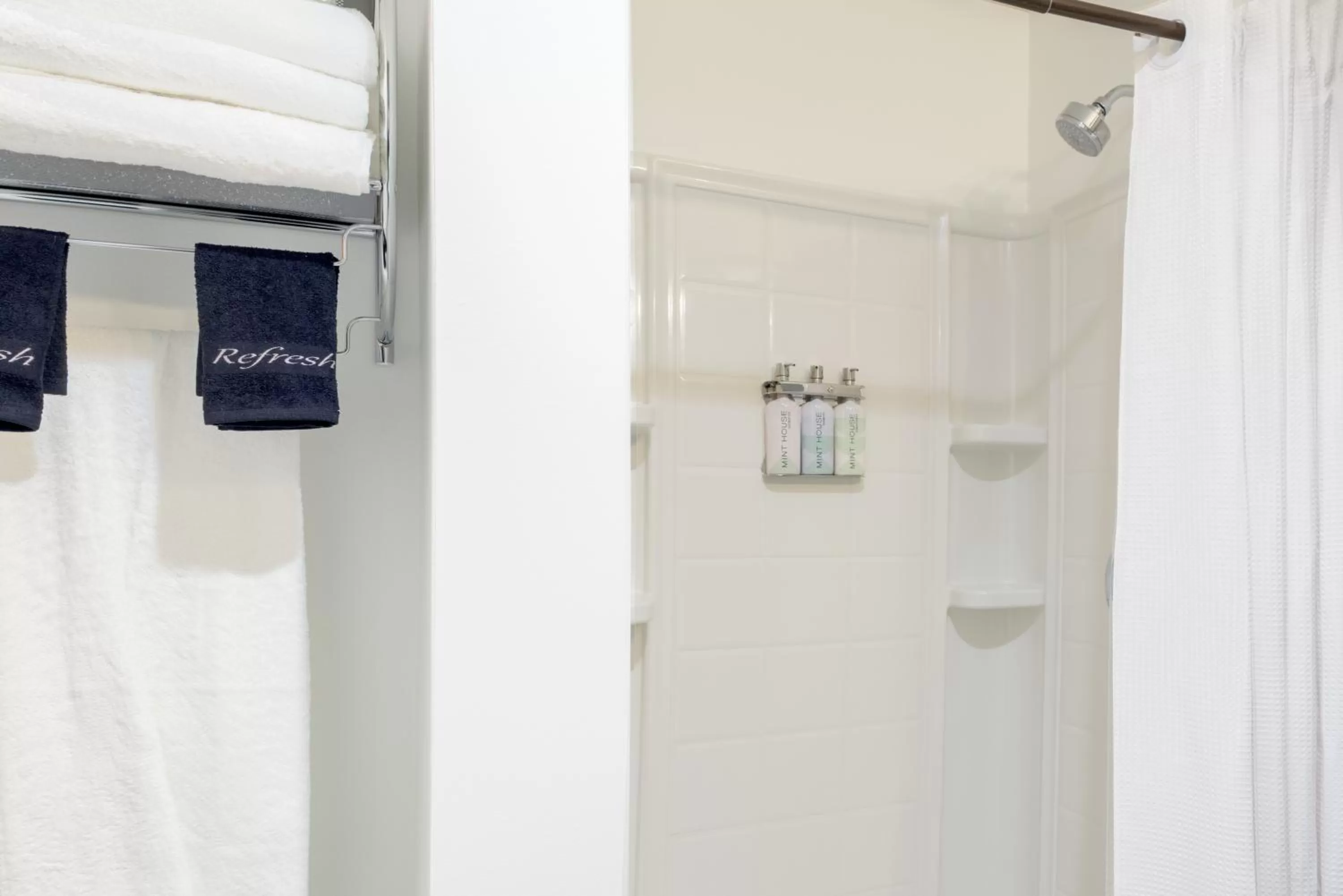 Bathroom, TV/Entertainment Center in Mint House Detroit - Times Square