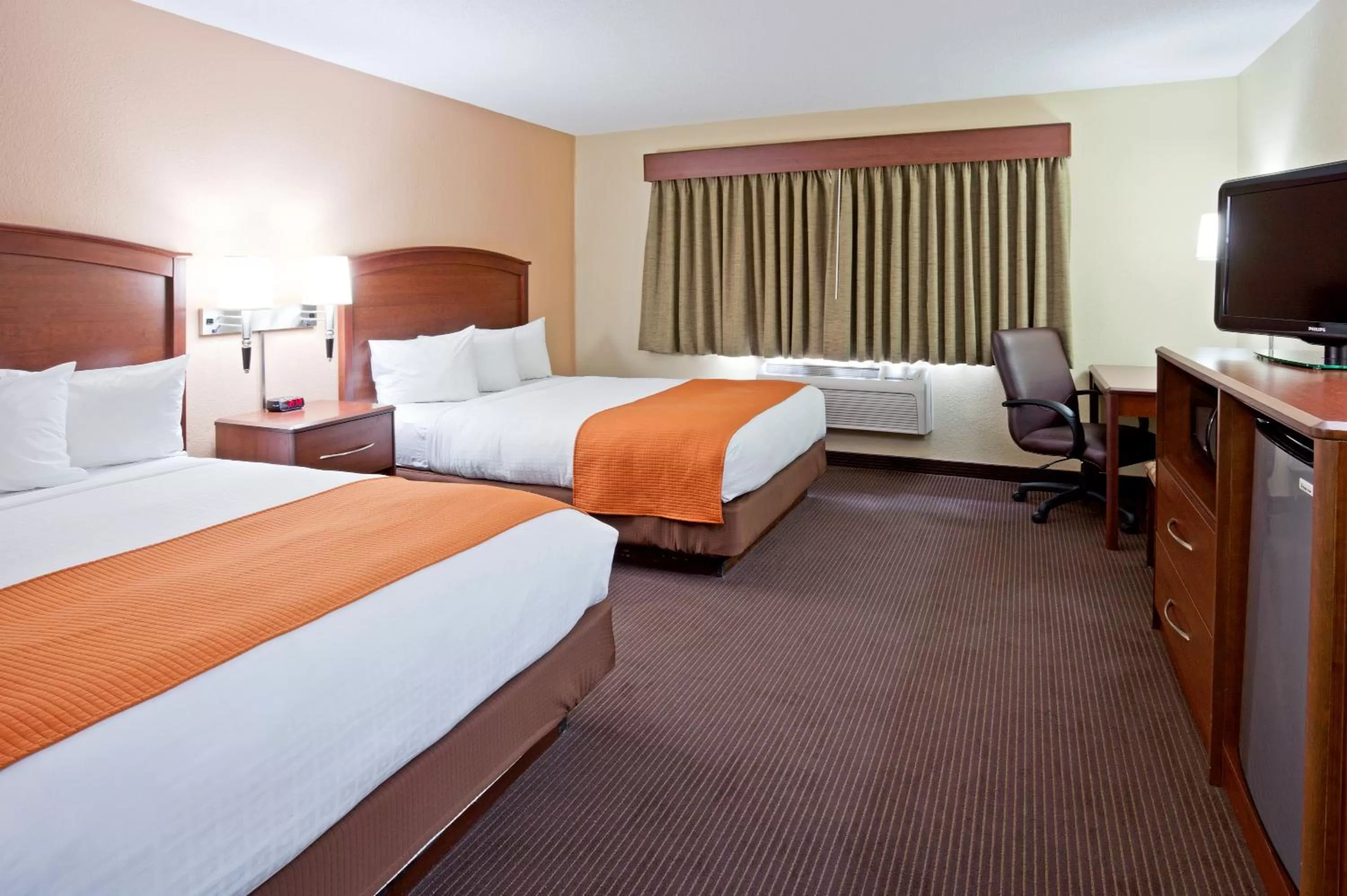 Bed in AmericInn by Wyndham Fargo West Acres