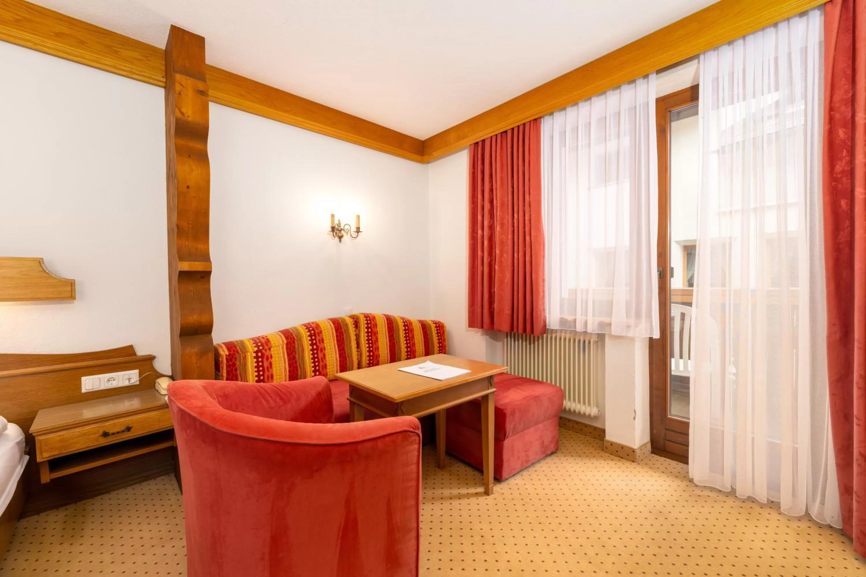 Seating area, Bed in Hotel Schwarzer Adler