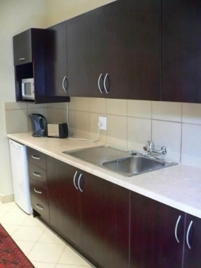 Kitchen or kitchenette in Rustenburg Boutique Hotel