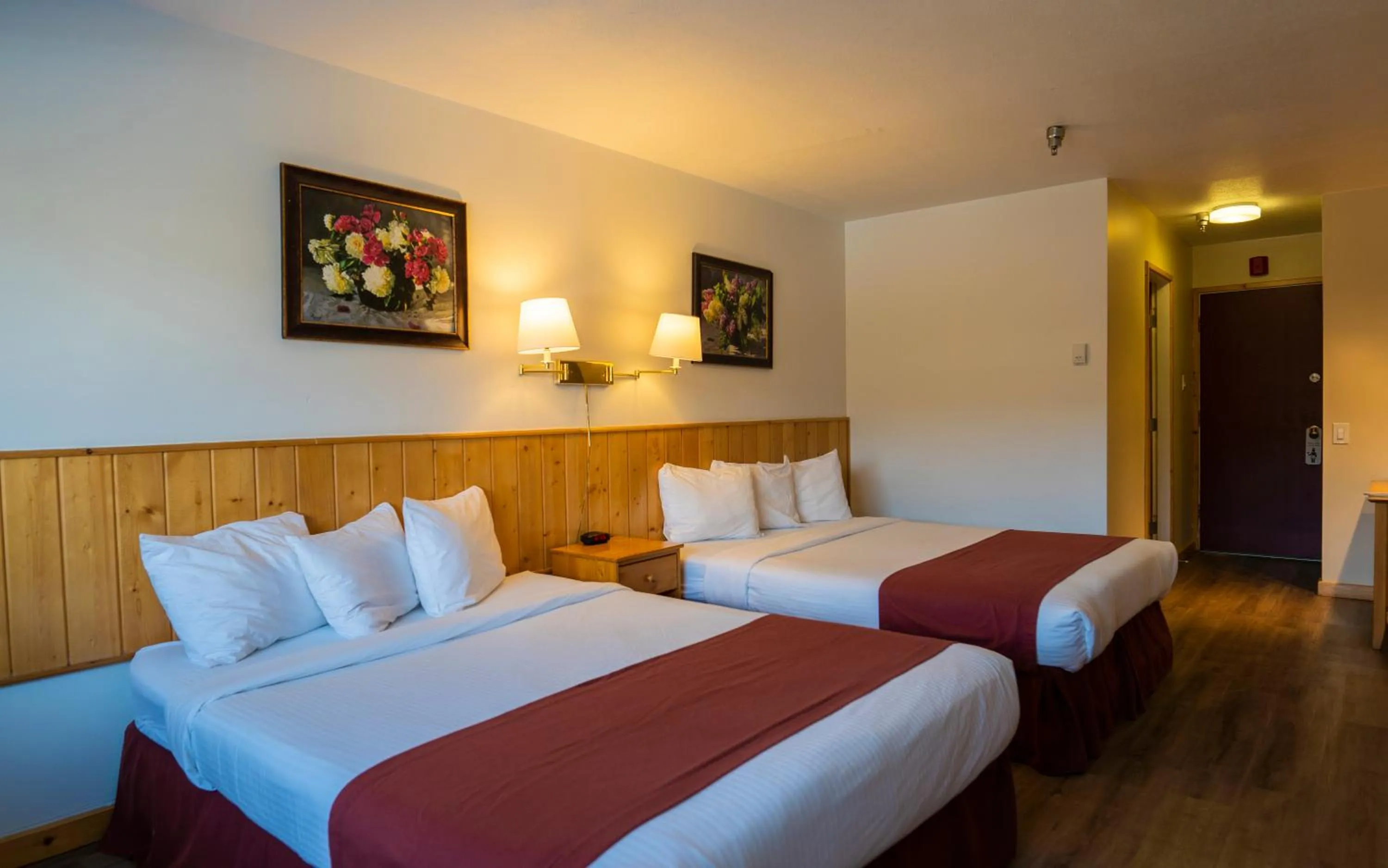 Bed in Canadas Best Value Inn- Riverview Hotel