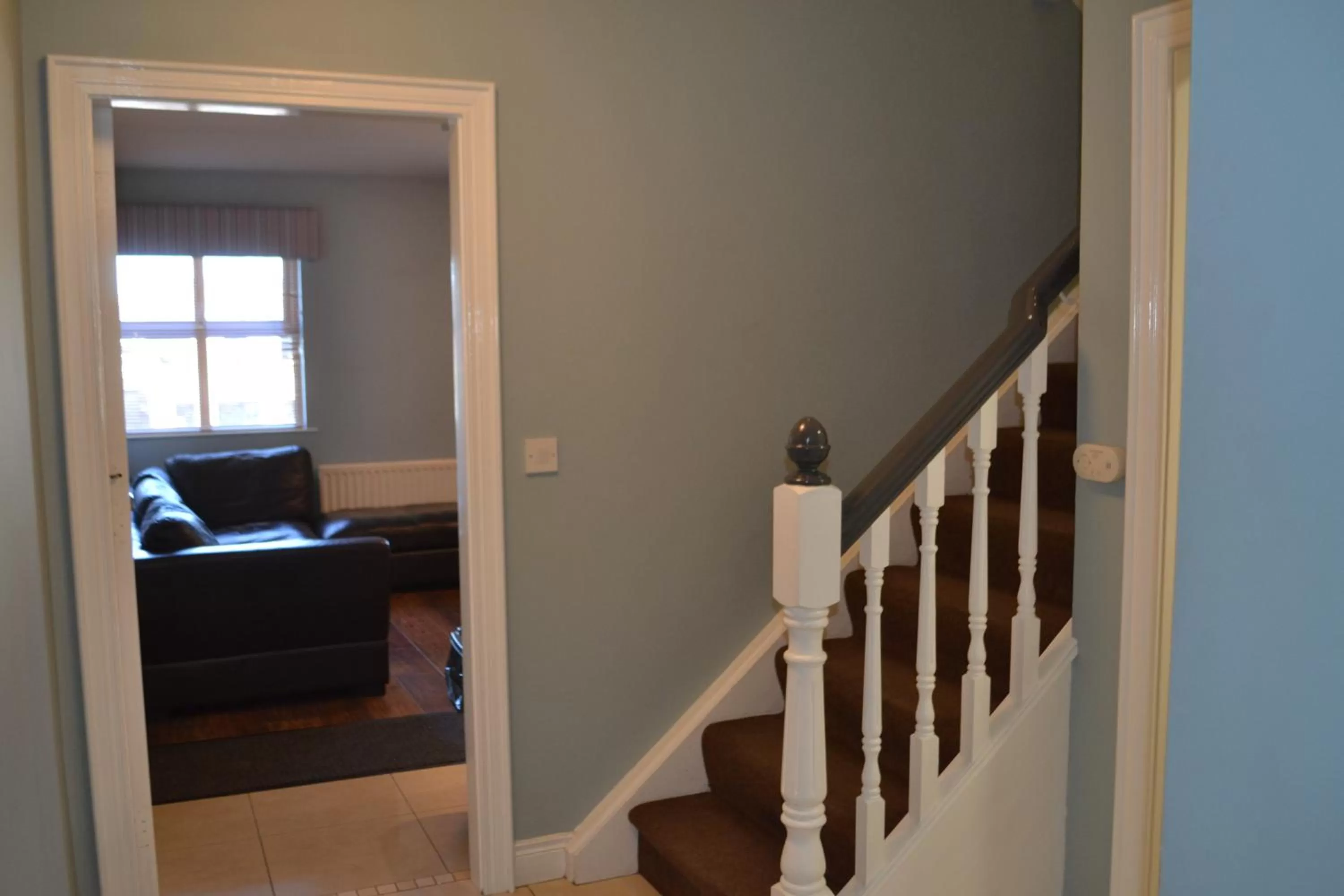 Communal lounge/ TV room in Walsh's Hotel and Apartments