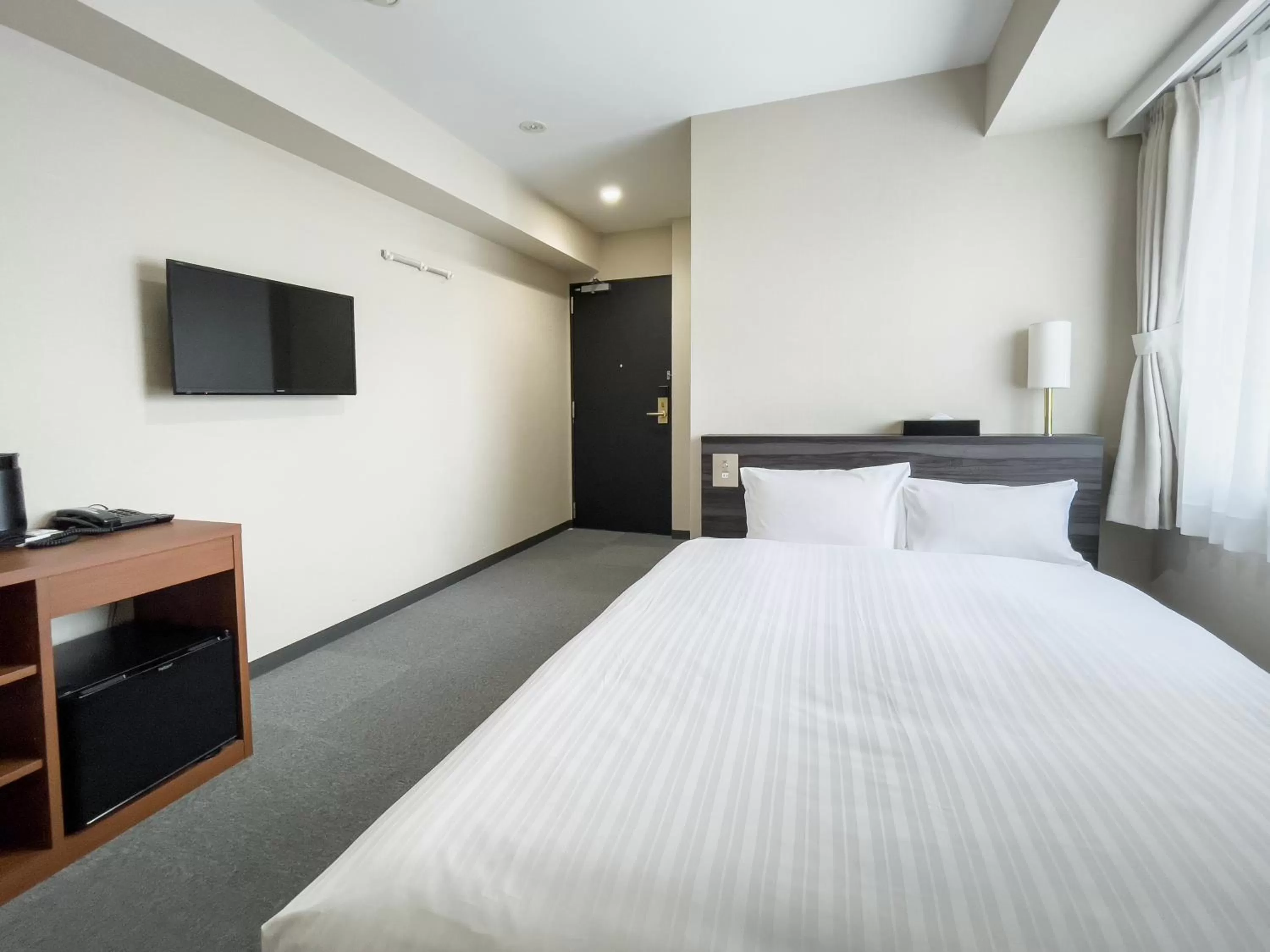 Bed in CHECKinn Osaka Shinimamiya