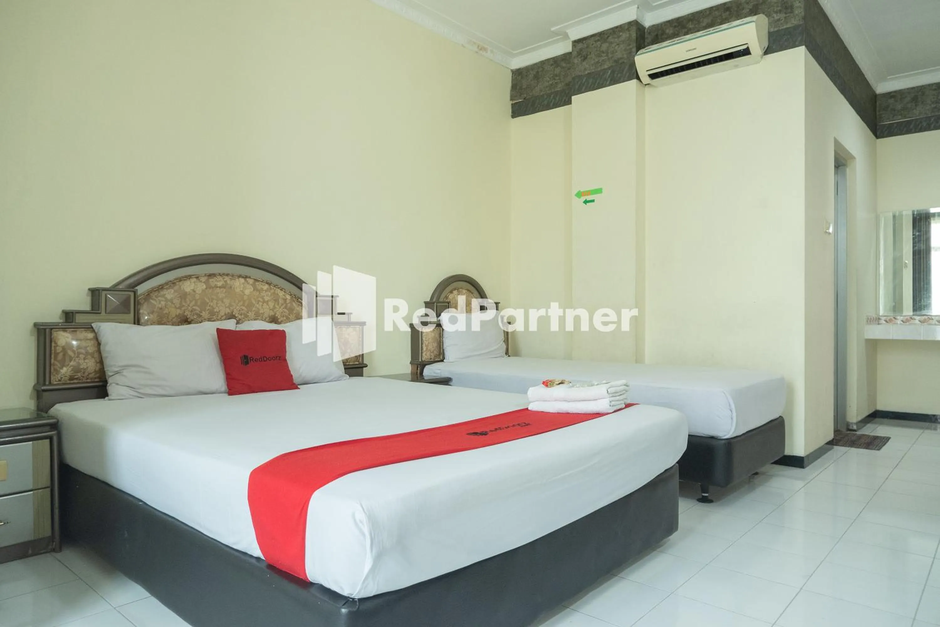 Bed in Akur Hotel Malioboro Mitra RedDoorz