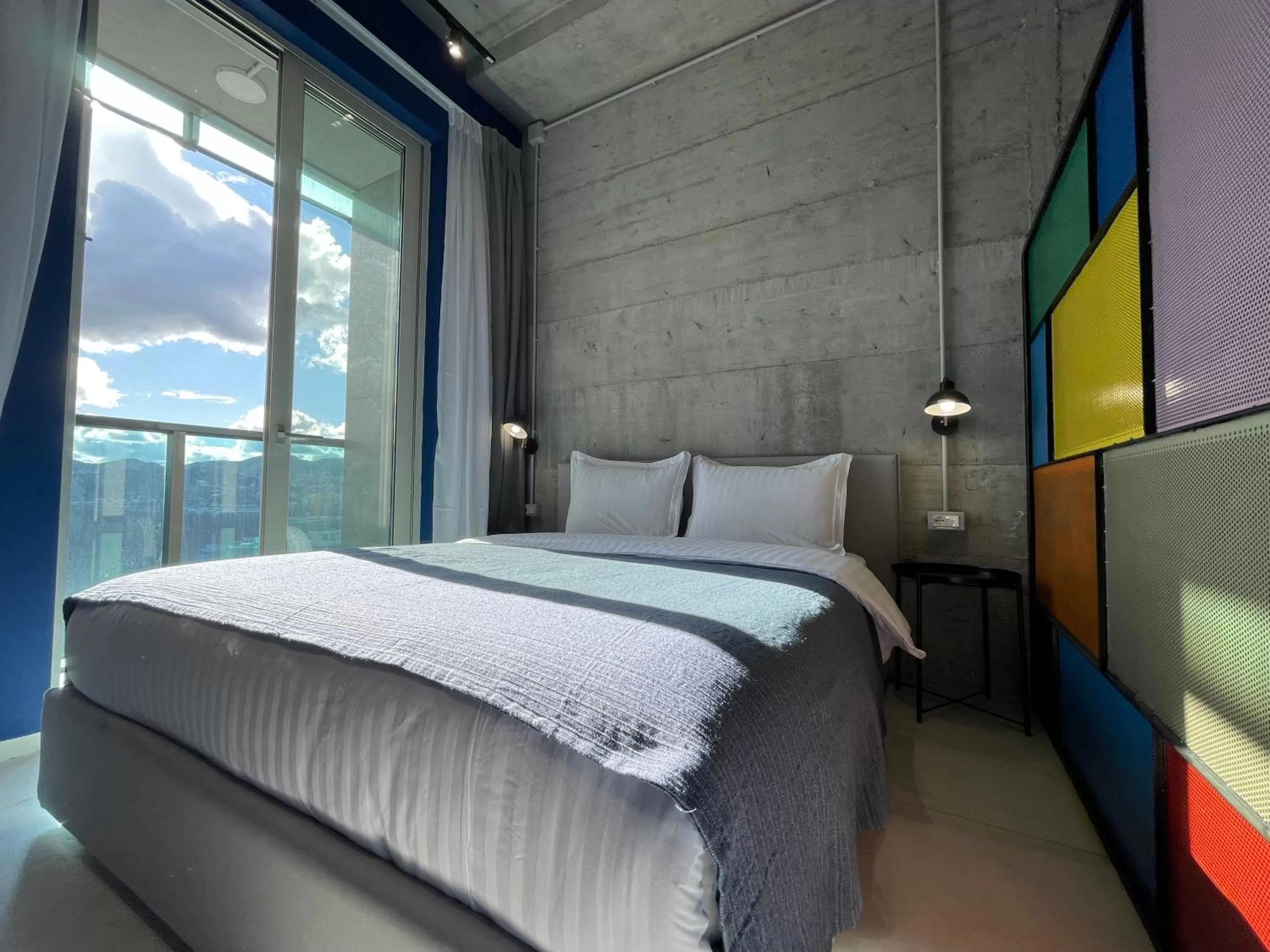 Bed in Ambassador Skyline Apartments