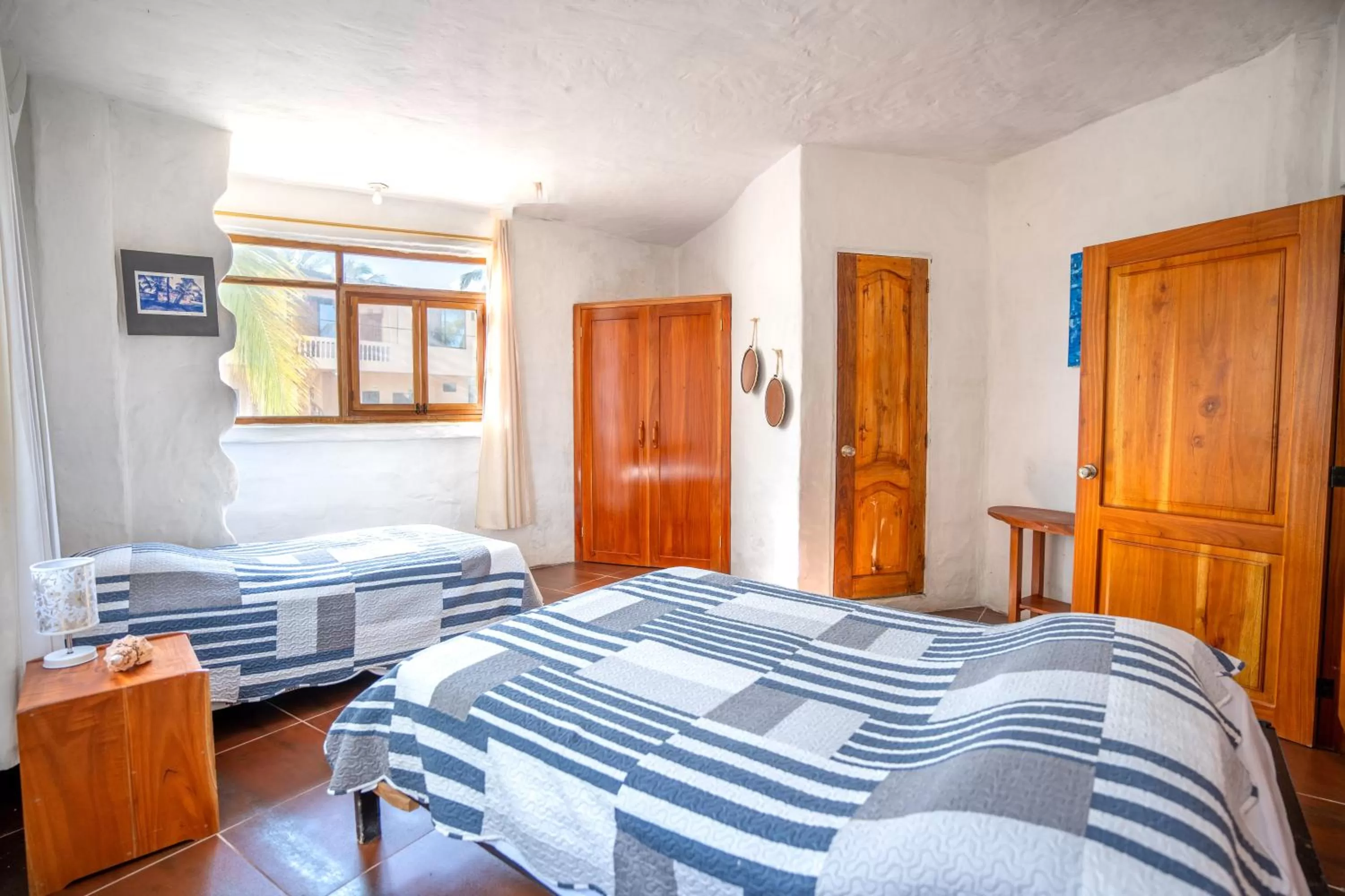 Bed in Hostal Galapagos by Bar de Beto