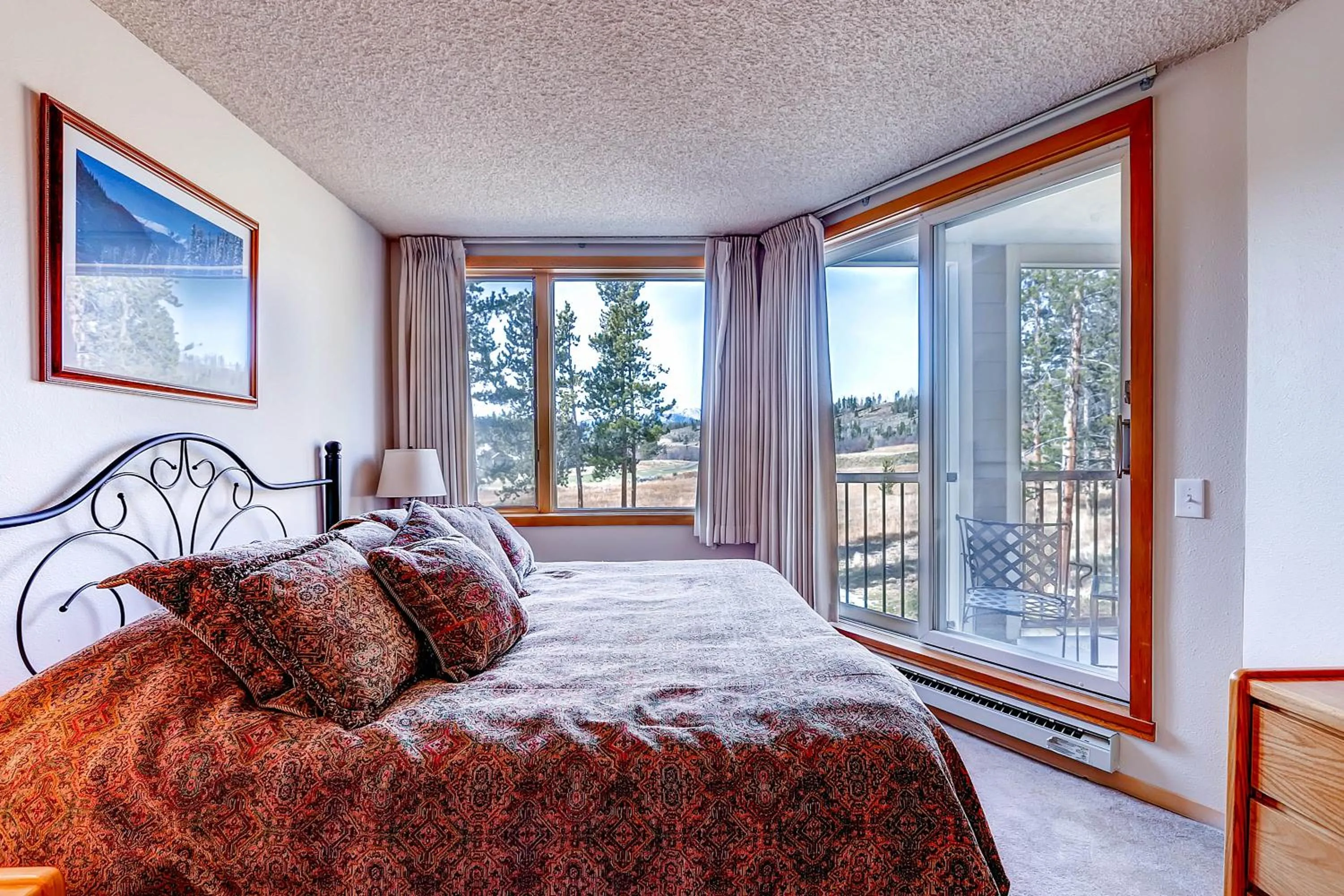 Bed in Evergreen Condominiums by Vail Resorts