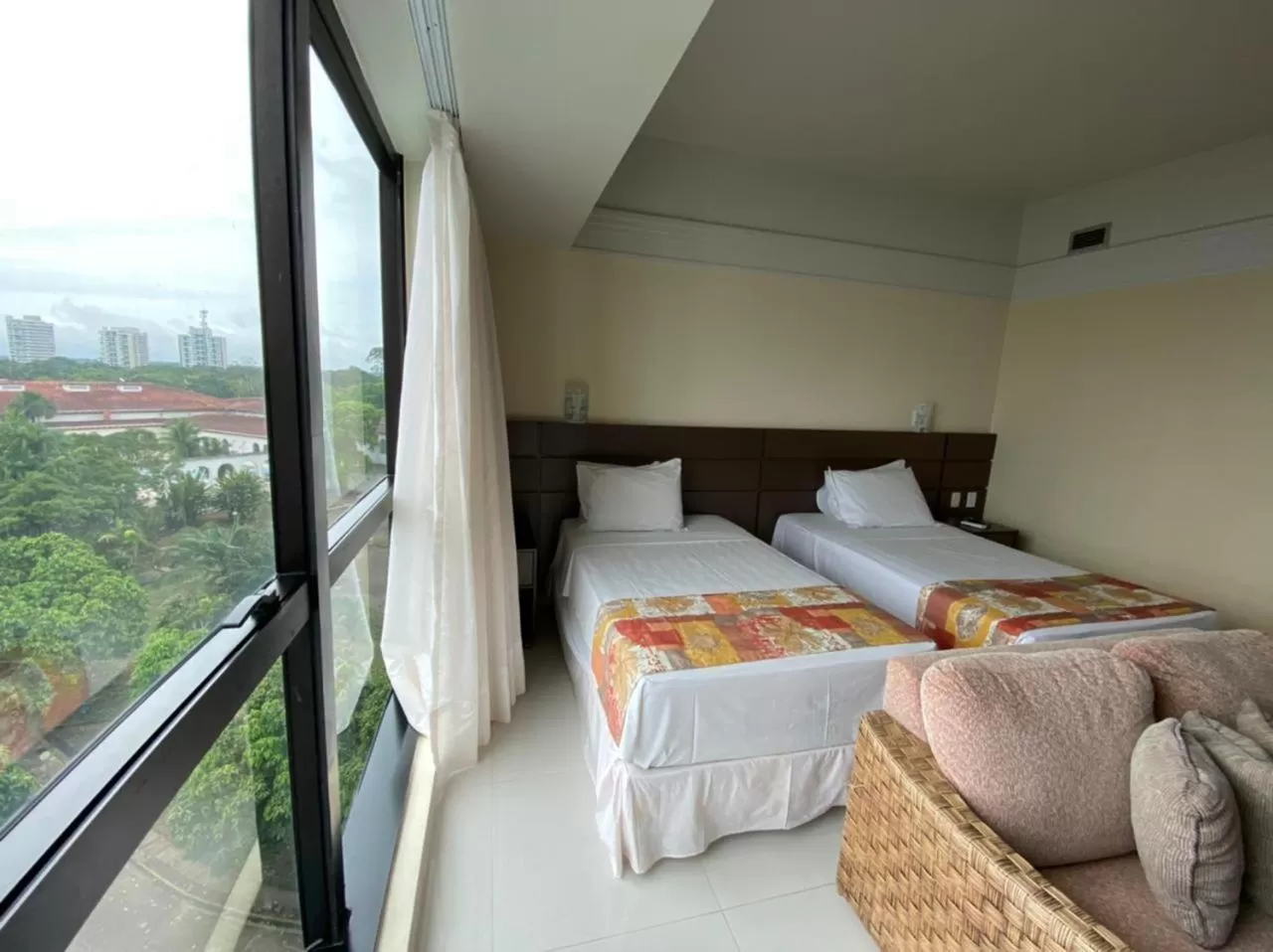 Bed in Tropical Executive Hotel