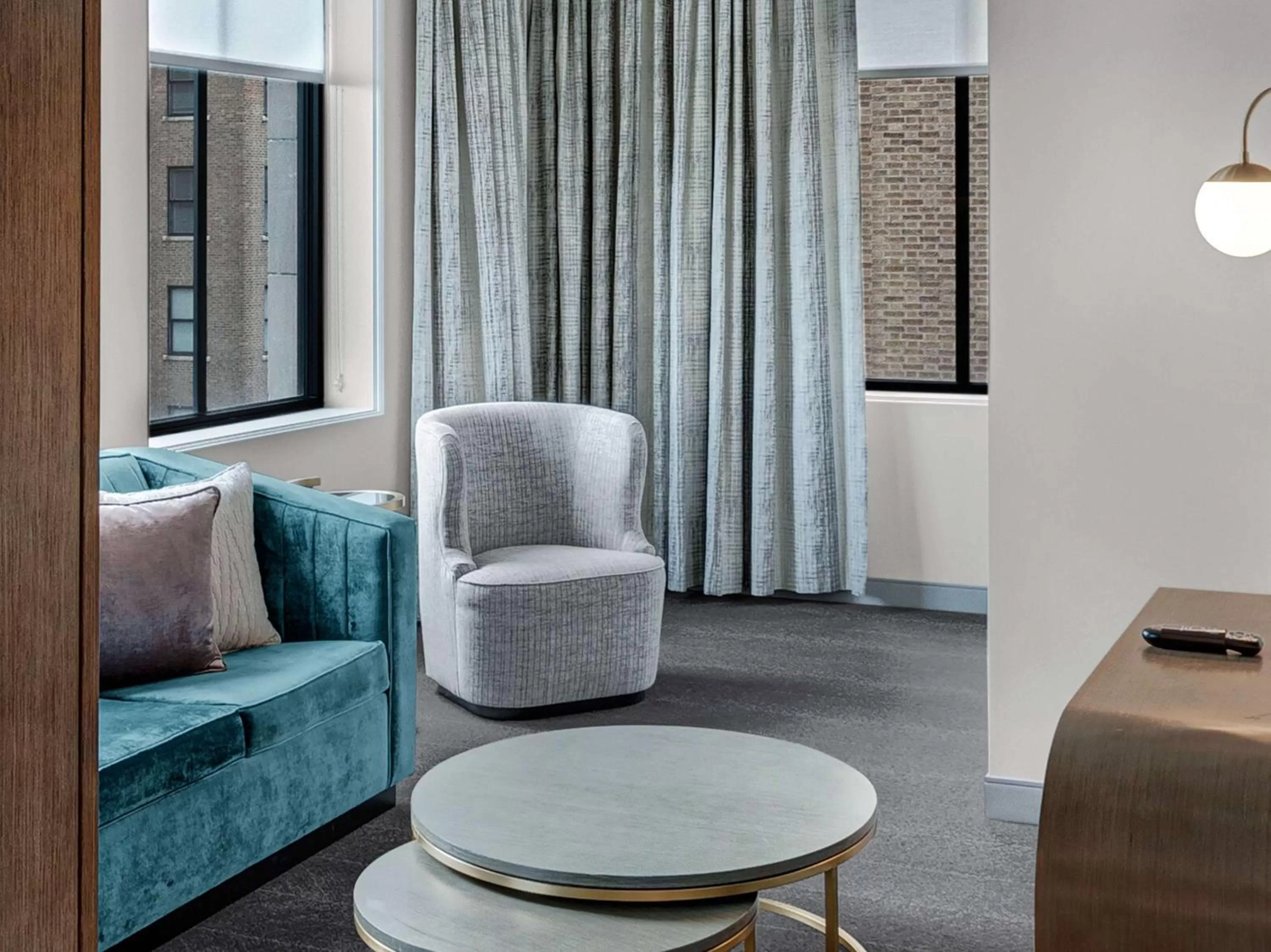 Living room in Tulsa Club Hotel Curio Collection By Hilton