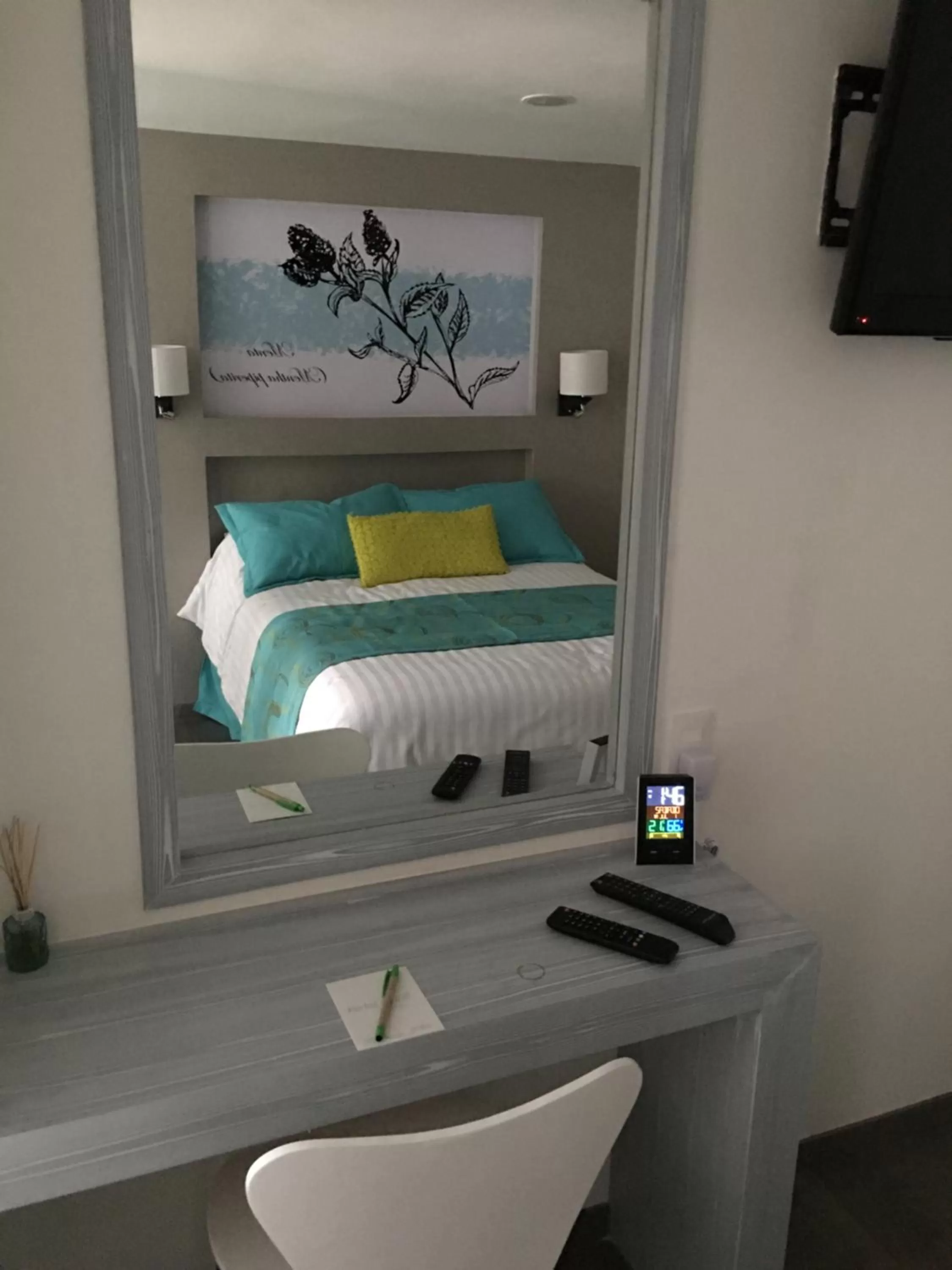 Bed in Herbal Inn Suites