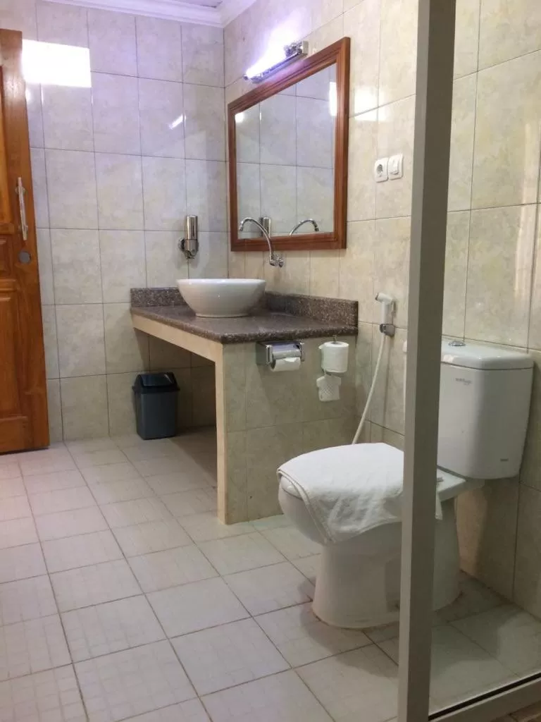 Bathroom in Astina Hotel