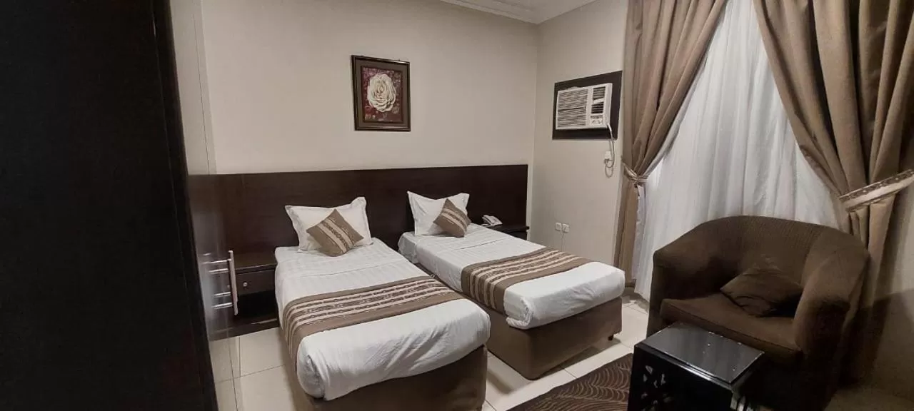 Bed in Shams Suites Furnished Units
