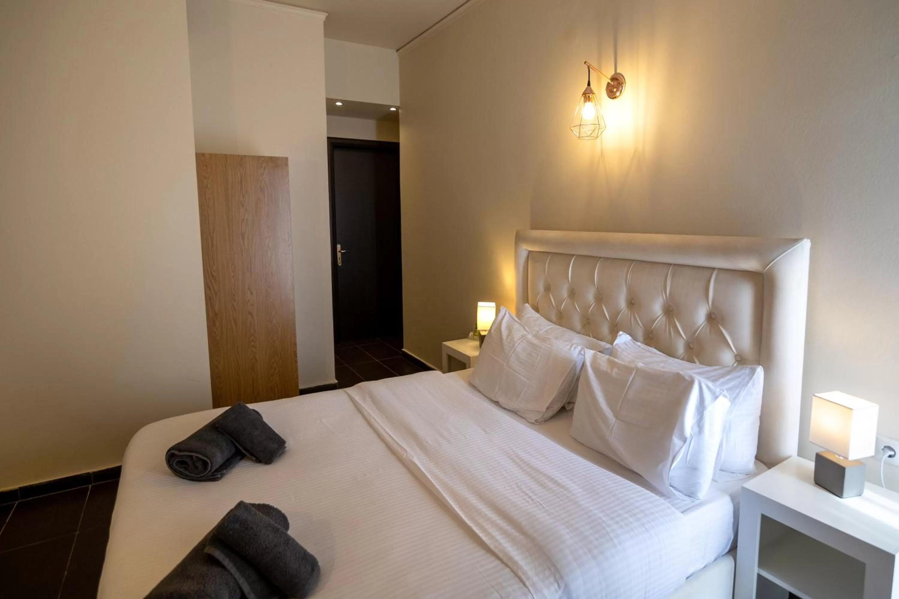 Bed in Votsalakia Hotel & Luxury Apartments