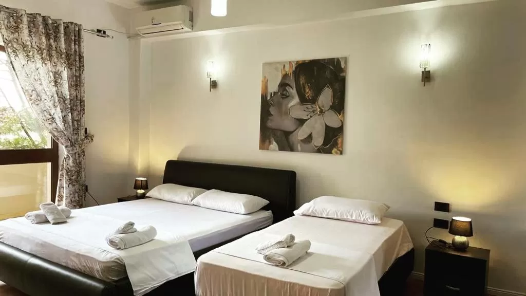 Bed in Hotel Ambasador Garden