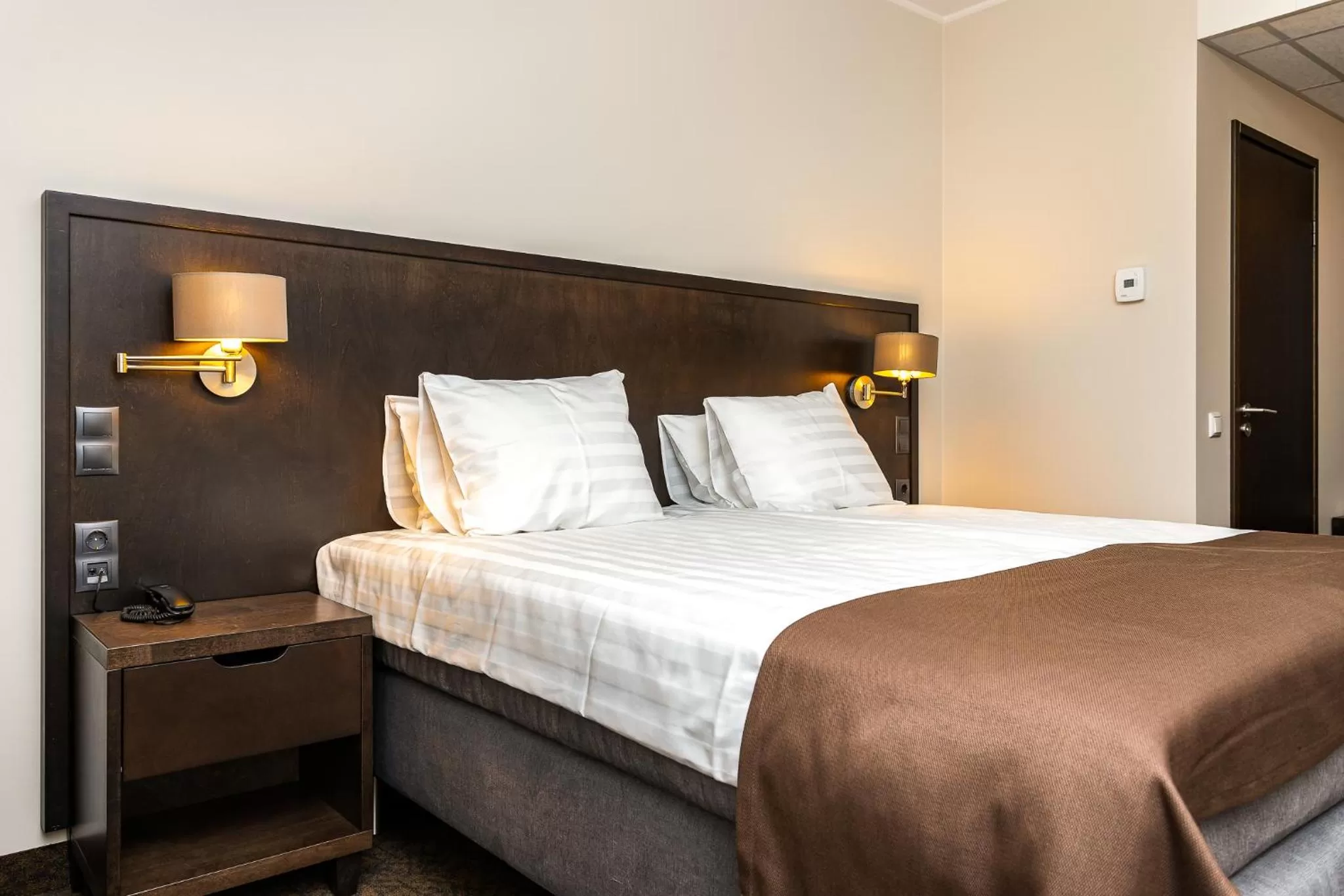 Bed in Adoryal Hotell