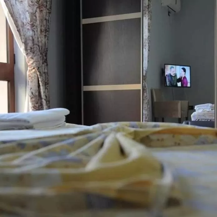 Bed in Hotel Ambasador Garden