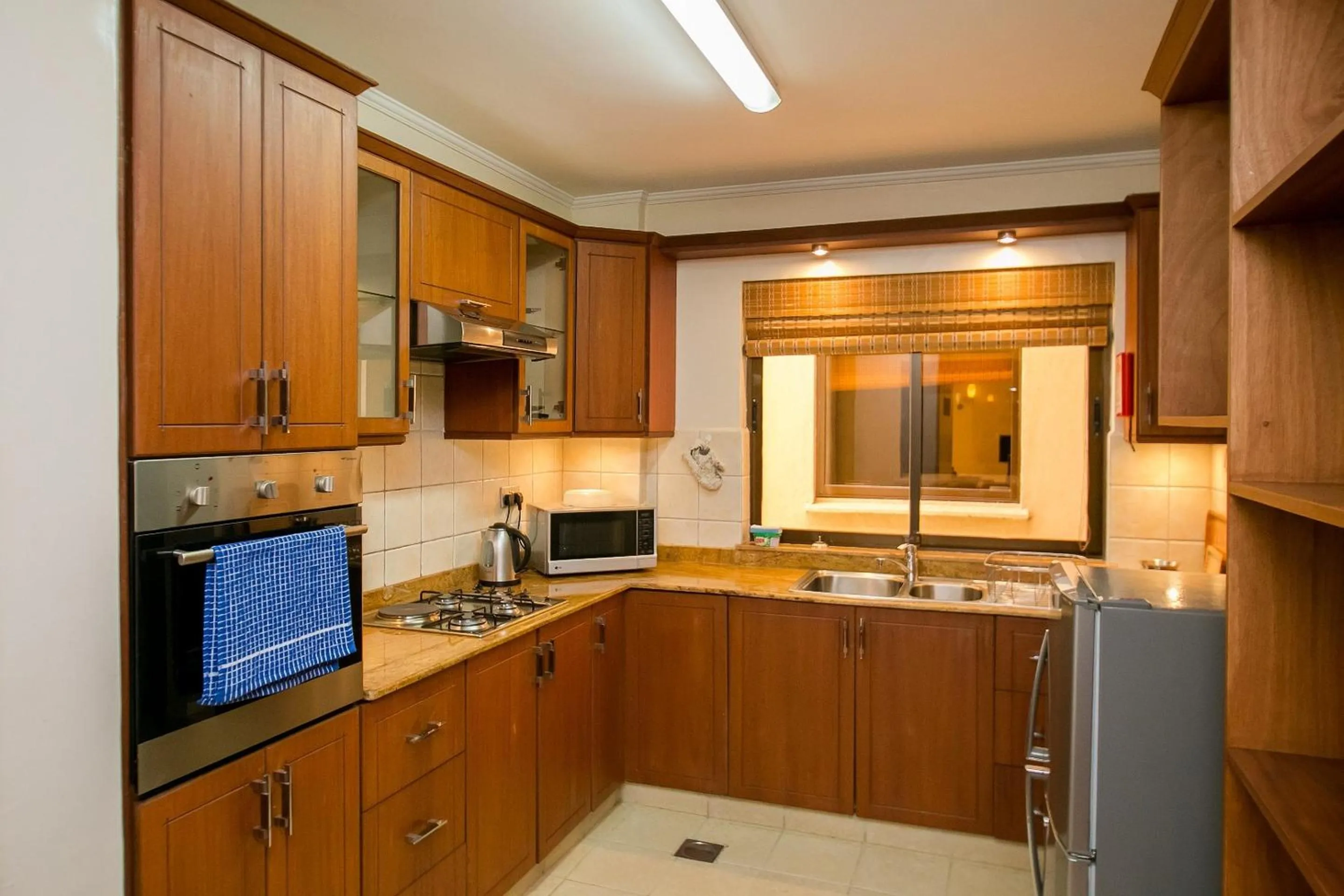 Kitchen or kitchenette in Waridi Paradise Hotel and Suites