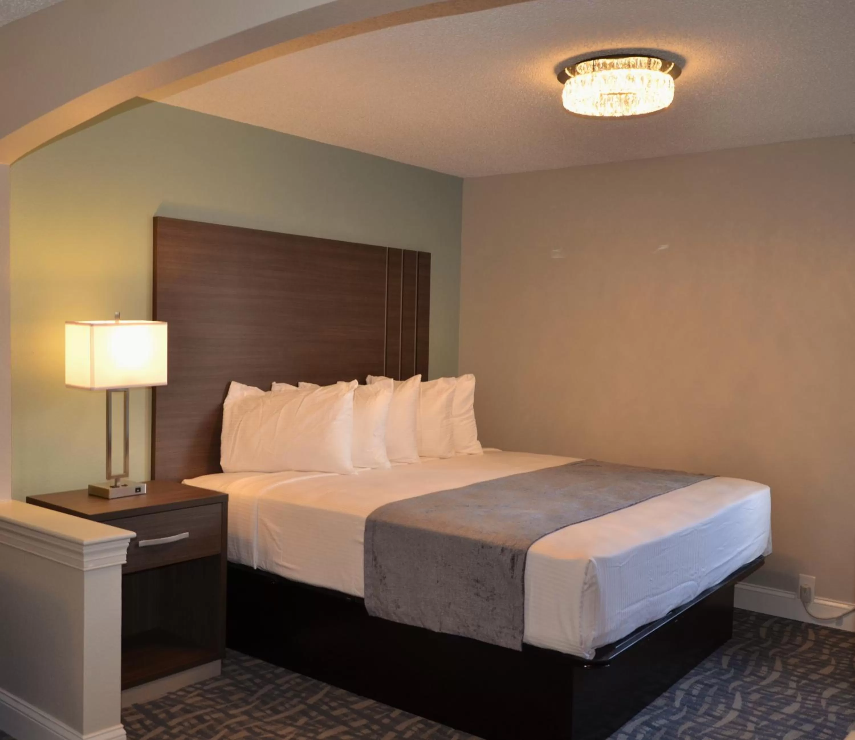 Bed in Opal Hotel & Suites