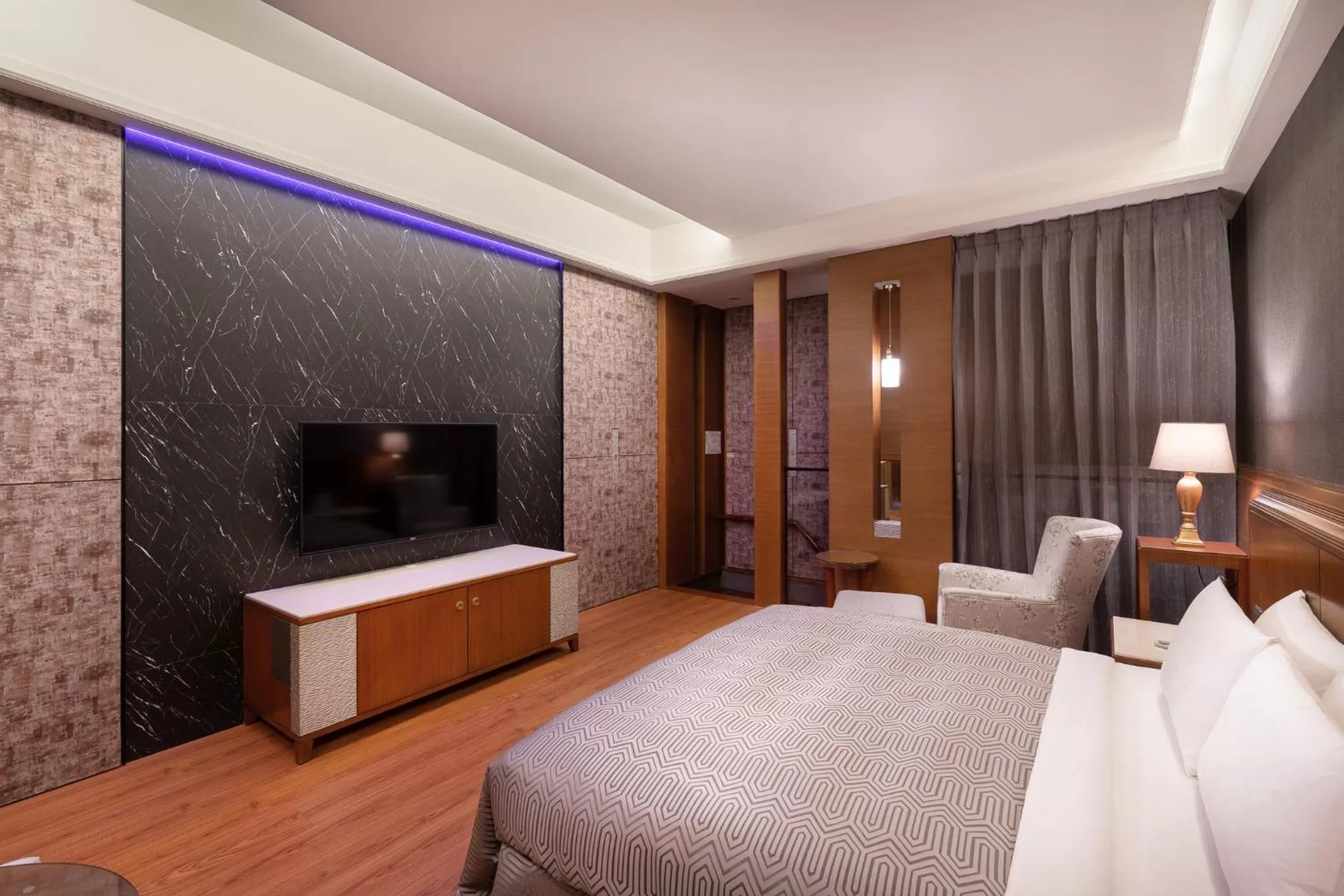 TV/Entertainment Center in Purple Garden Motel