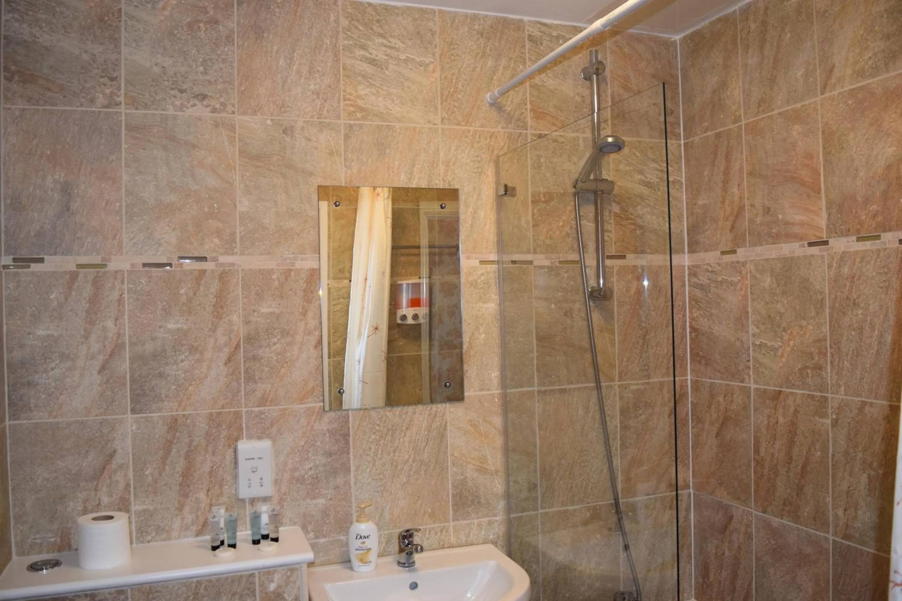 Bathroom in Star Anglia Hotel City Center by OYO