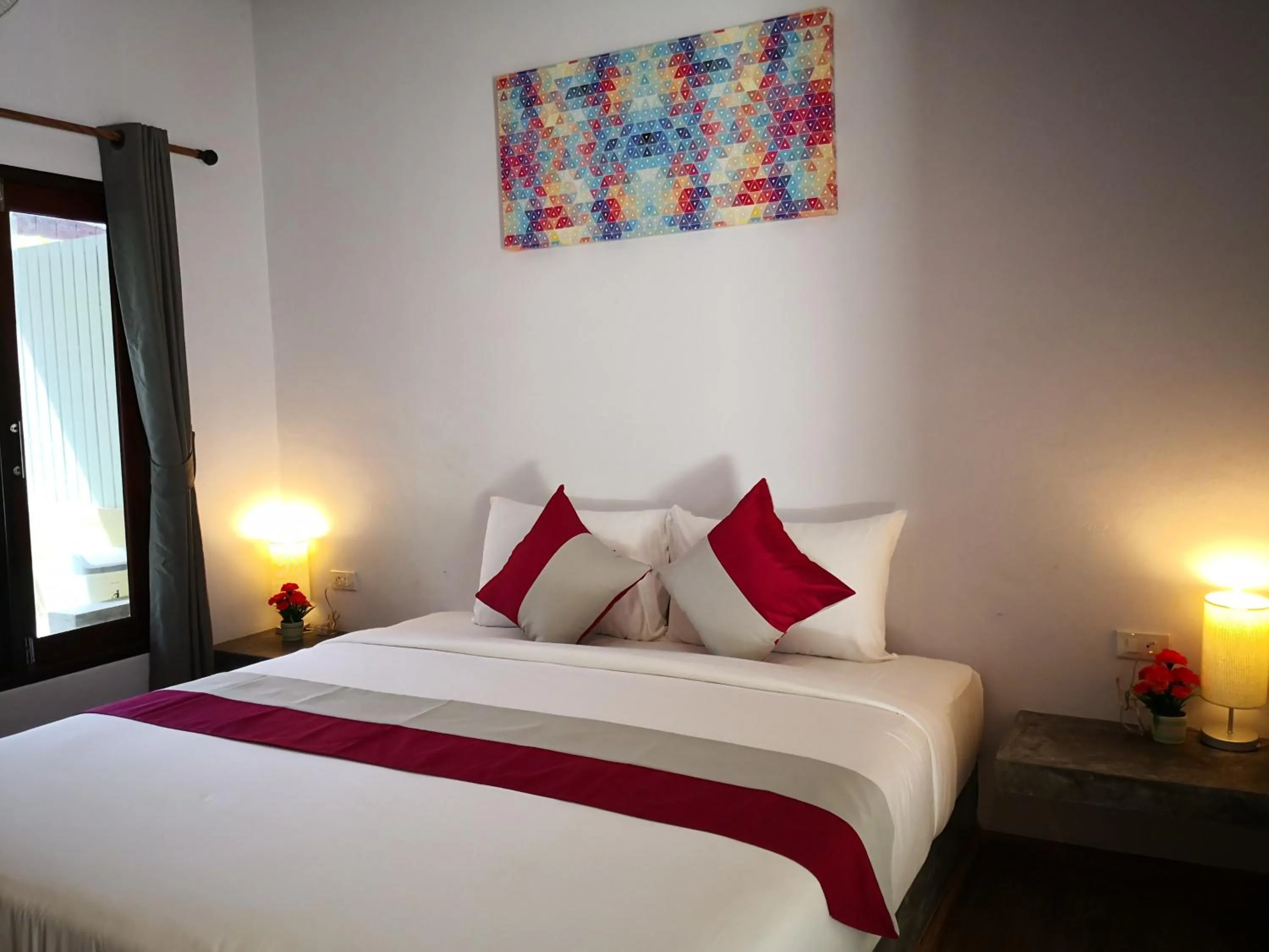 Bed in Baan Suan Rim Klong Resort